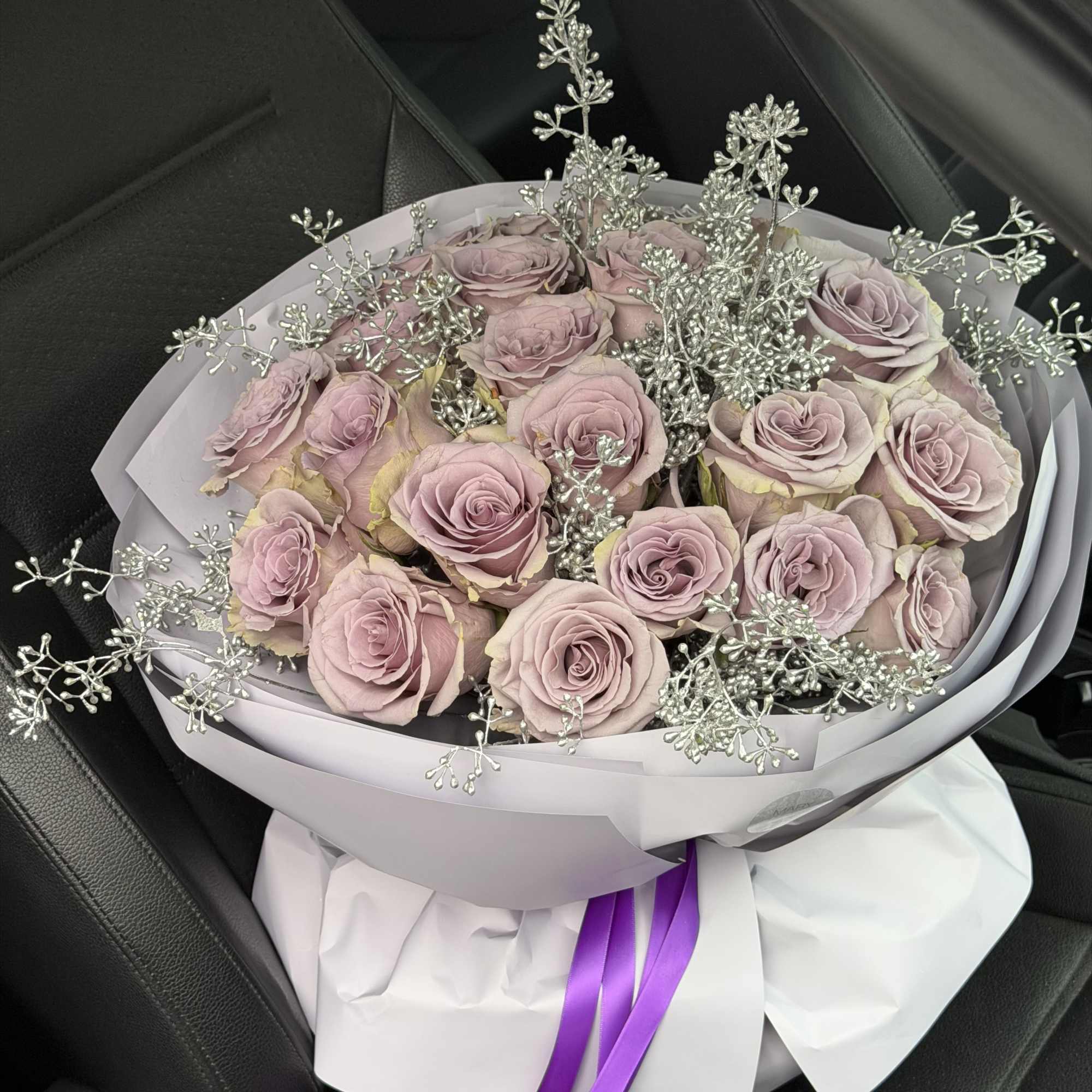 Soft, refined, and effortlessly elegant, this arrangement features premium lavender roses carefully