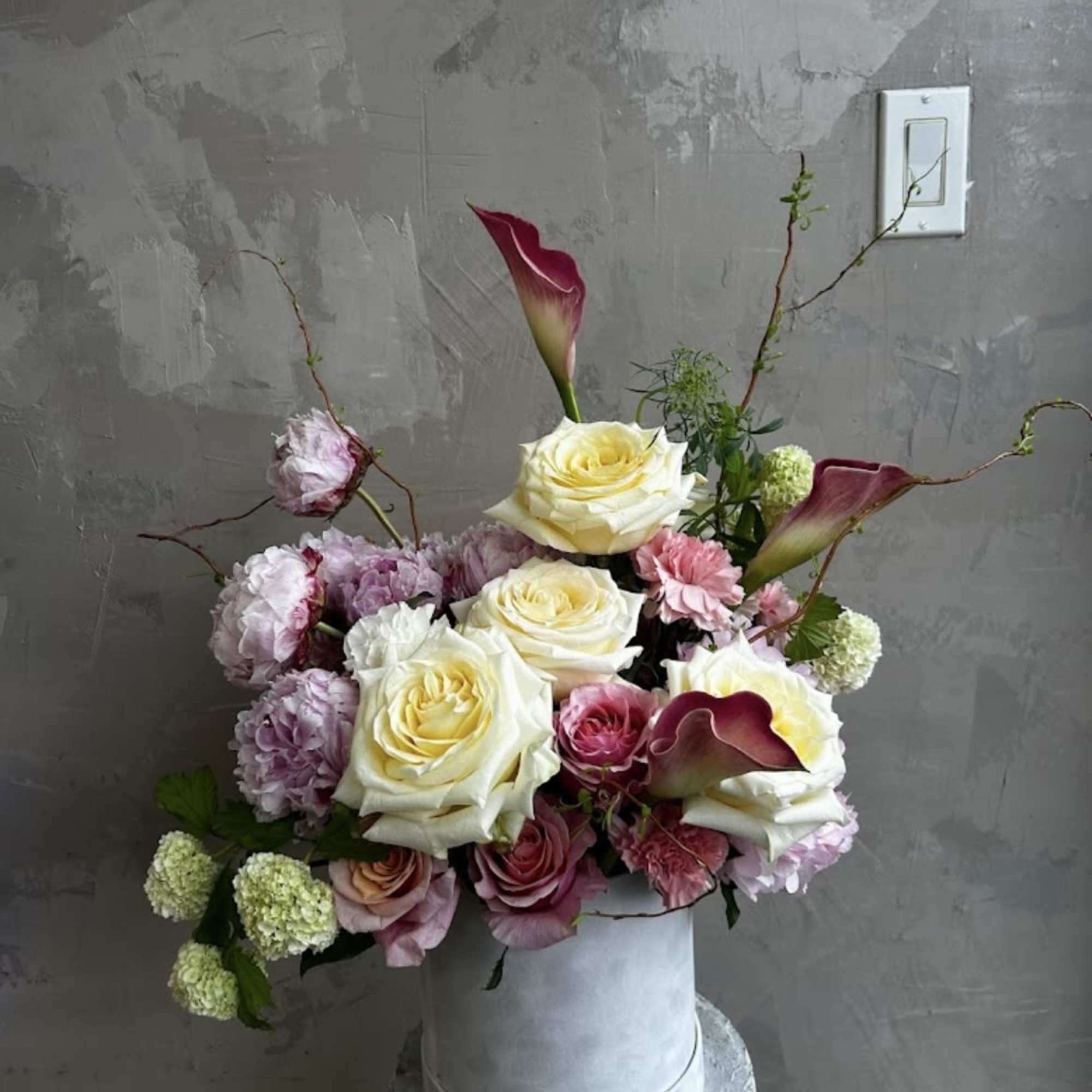Our Blush Elegance features a delicate mix of creamy roses, soft pink