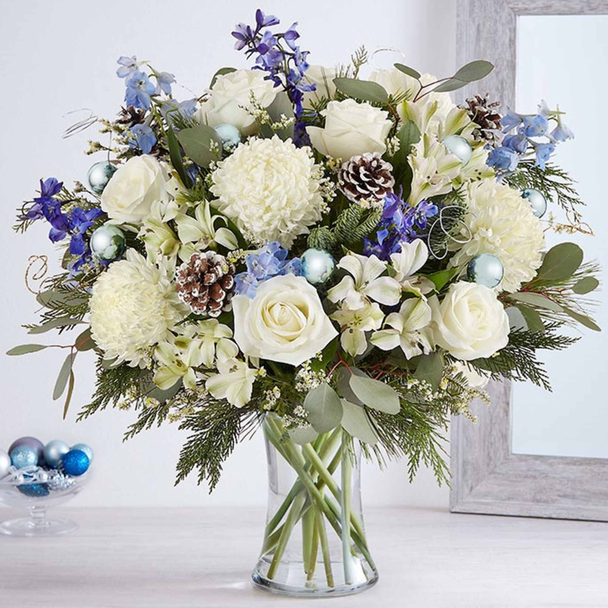 Send wonderful winters wishes with our luxurious arrangement. Snowy white blooms are