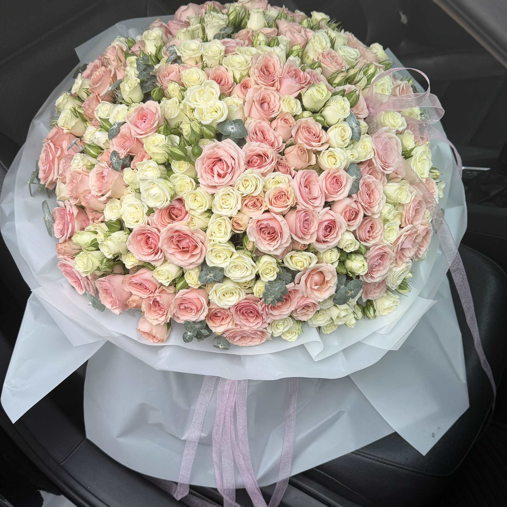 An exquisite expression of elegance, this grand arrangement features a lavish composition