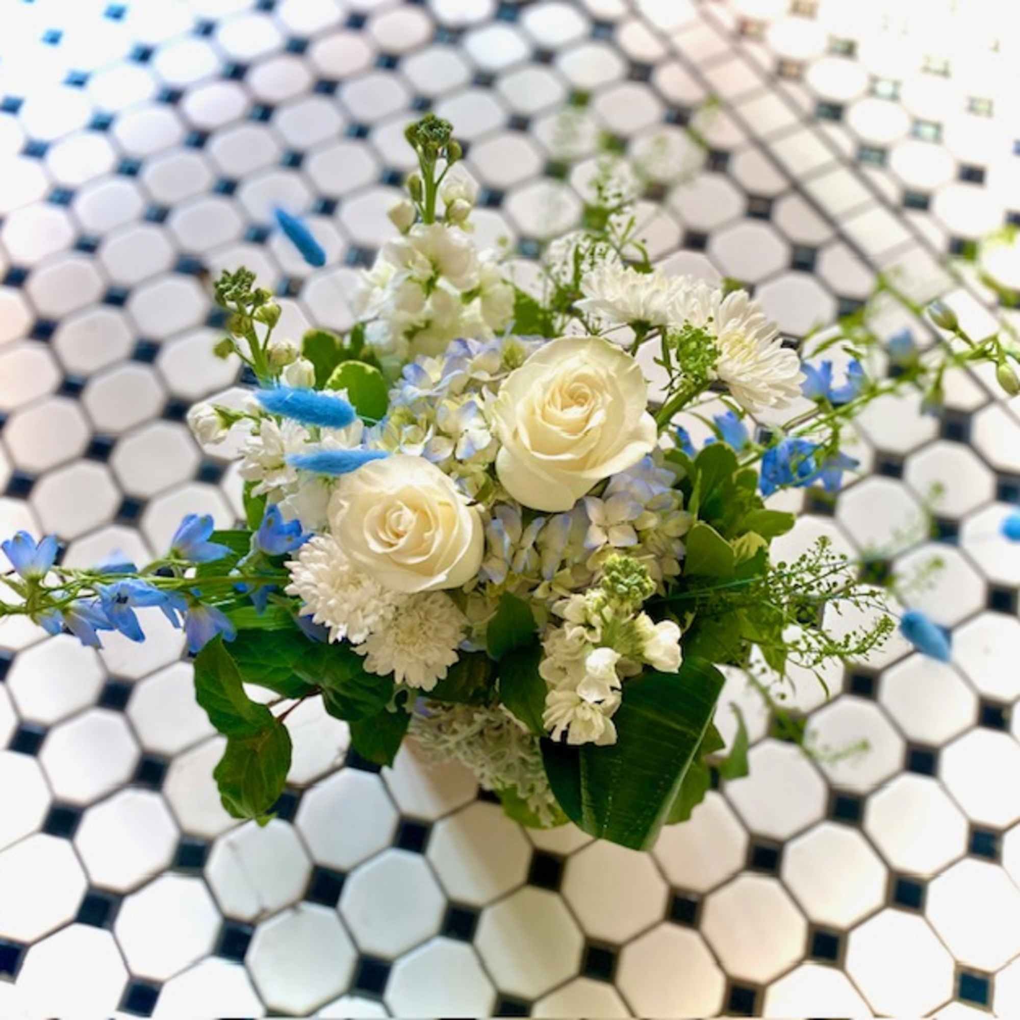 Beautiful and peaceful, this mixture of blue, green and white garden flowers