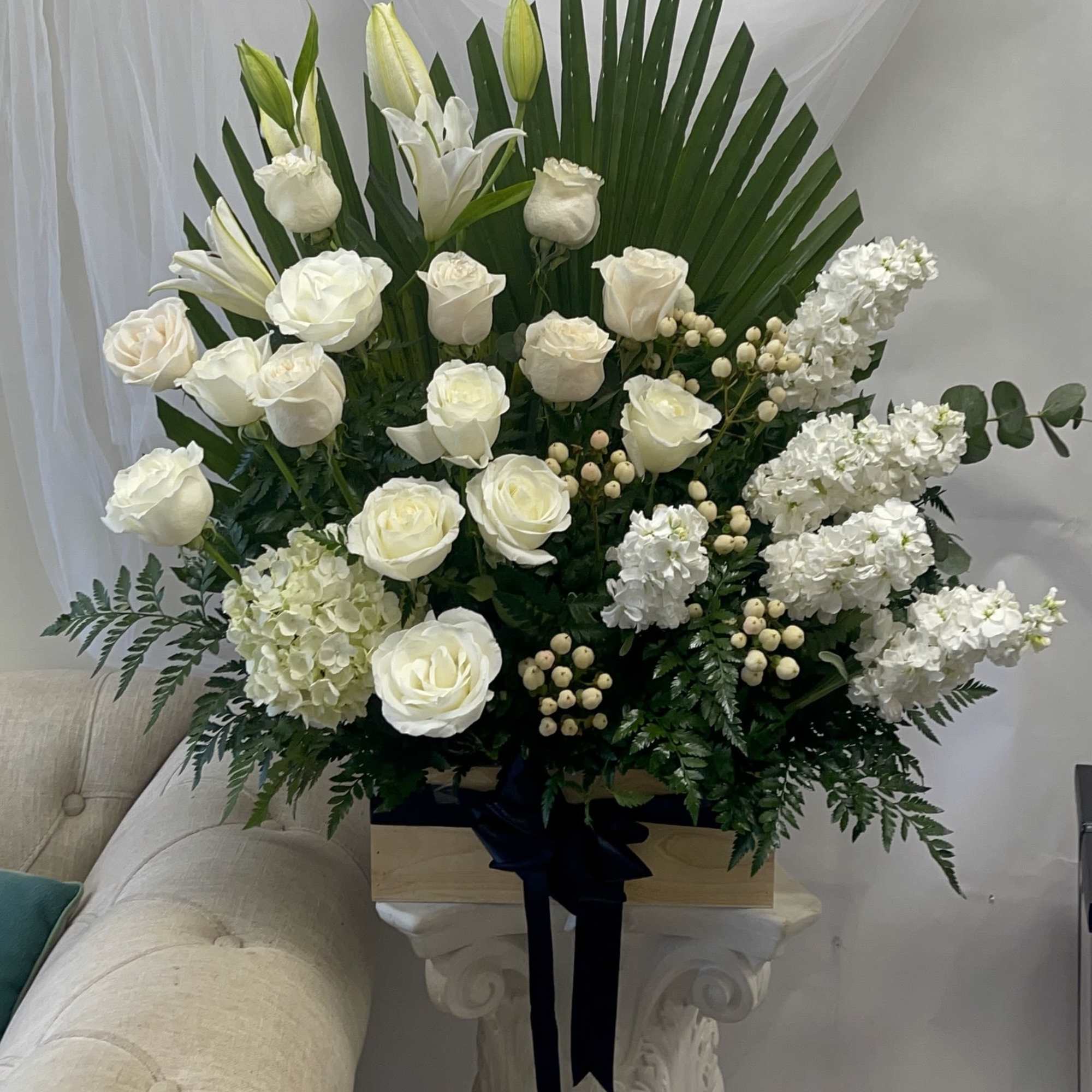 Theme Colors: Shades of whites and greens

Featured Blooms: Lilies, Roses, Hydrangea and