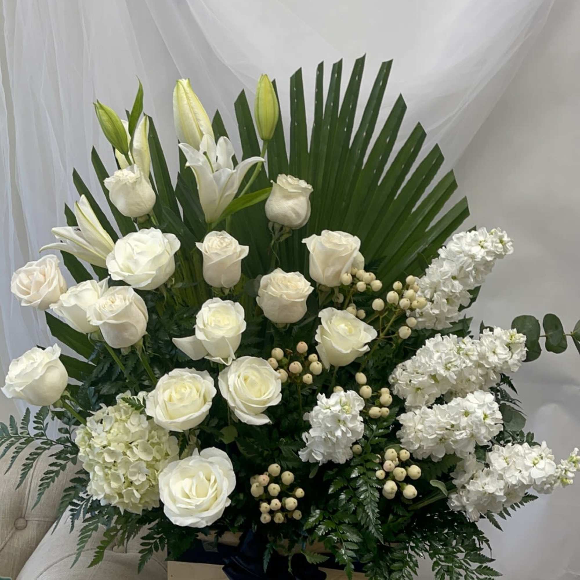 Theme Colors: Shades of whites and greens

Featured Blooms: Lilies, Roses, Hydrangea and
