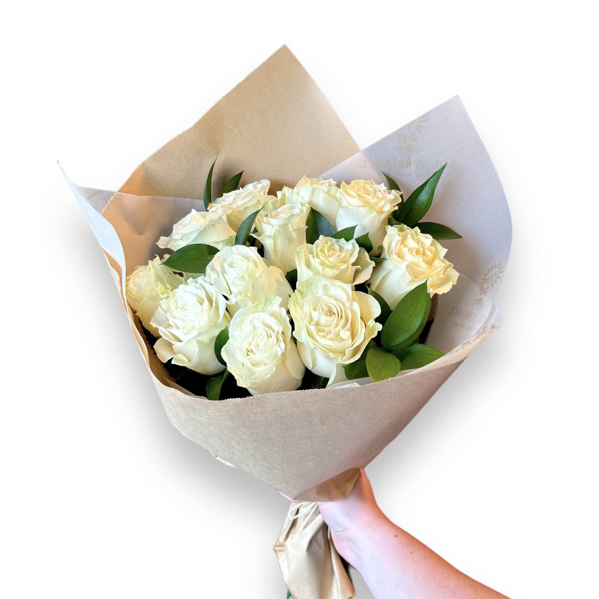 A dozen beautiful Ecuadorian long stem white roses delicately crafted with lush