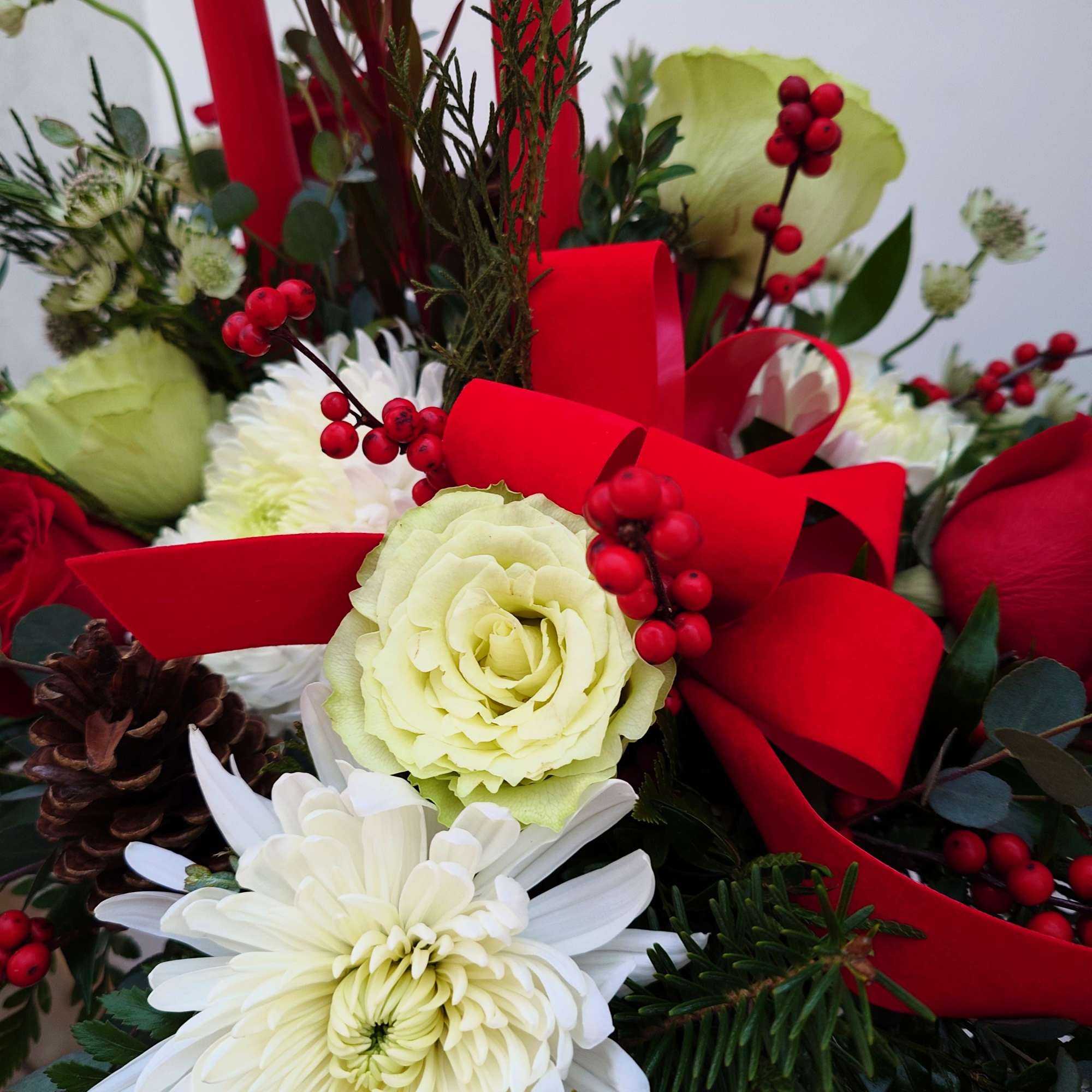 Bring holiday cheer to your table with this festive centerpiece featuring bright