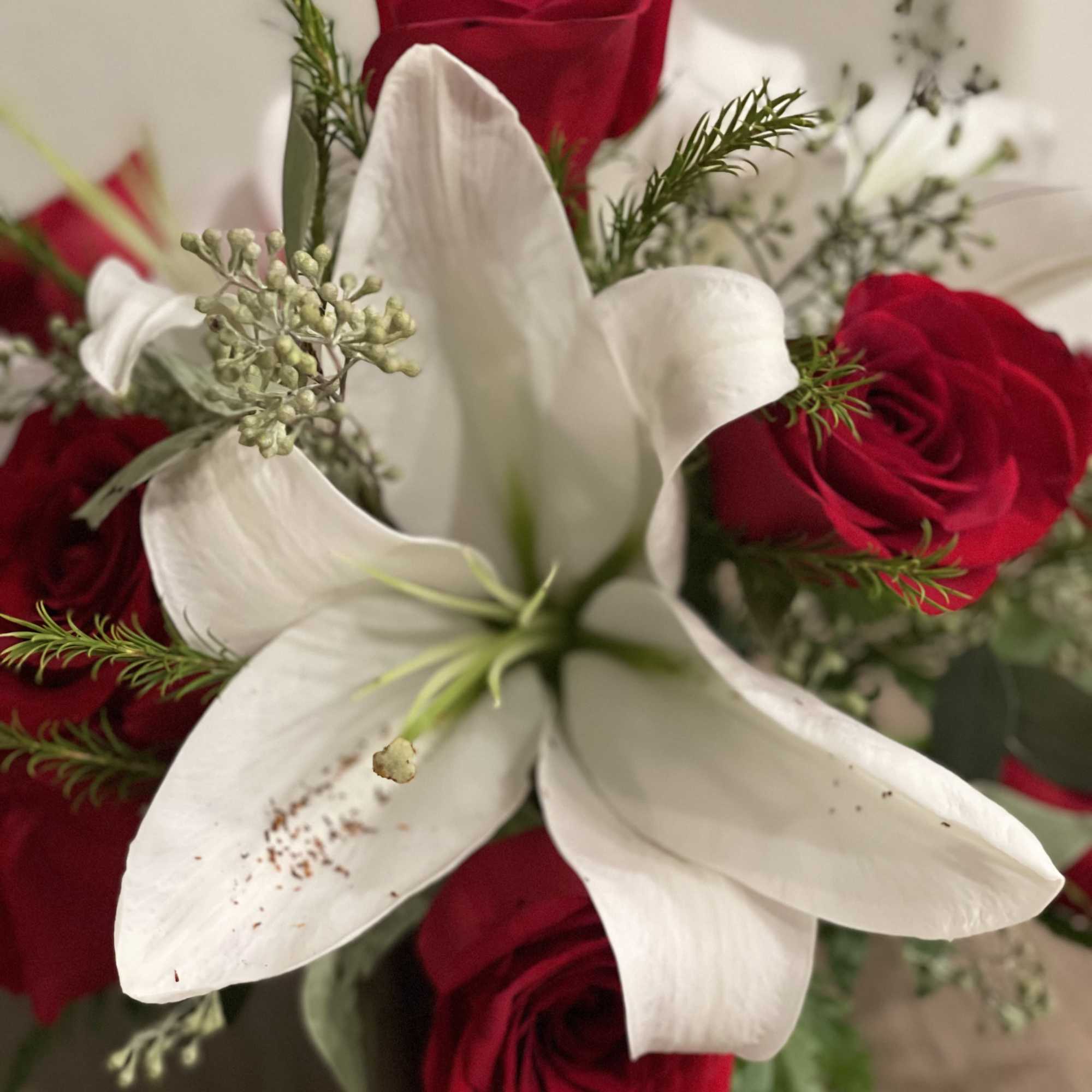 Cheerful floral arrangement of  red premium roses, white Asiatic lilies and