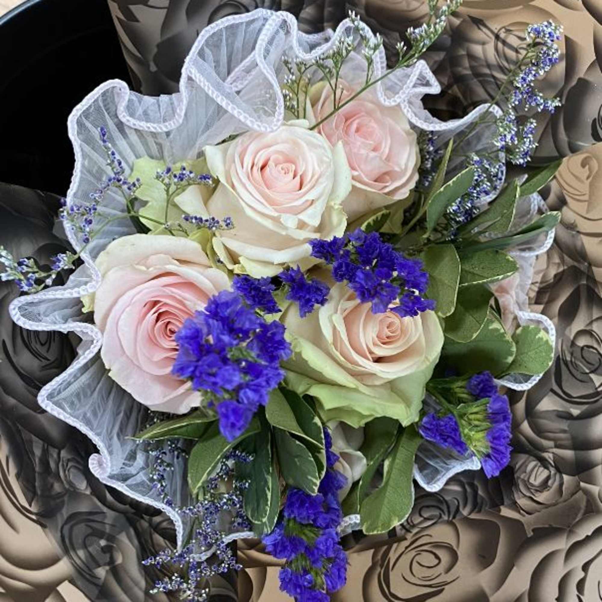 6 pink Roses with some sparkly 
Statice , and lavander Limonium 