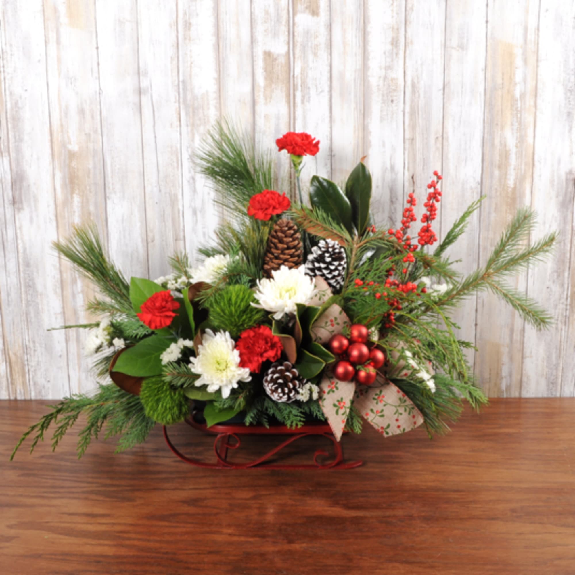 Small keepsake holiday sled with holiday blooms.  