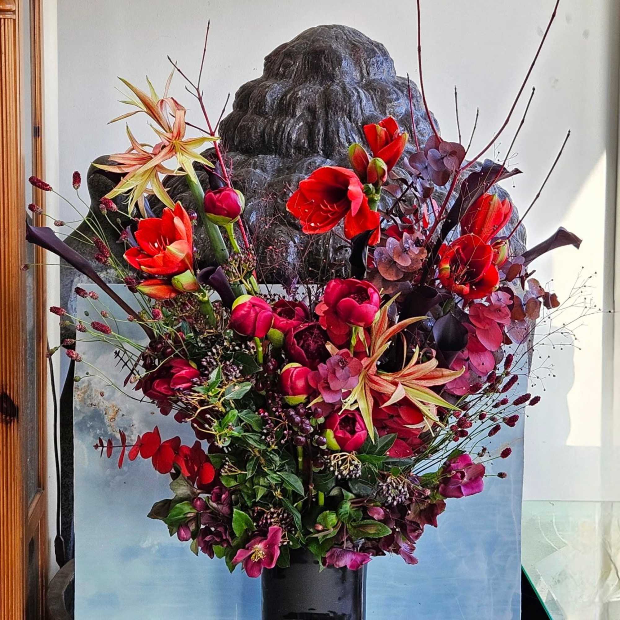 This woodsy contemporary arrangement has a very rich and moody palette. With