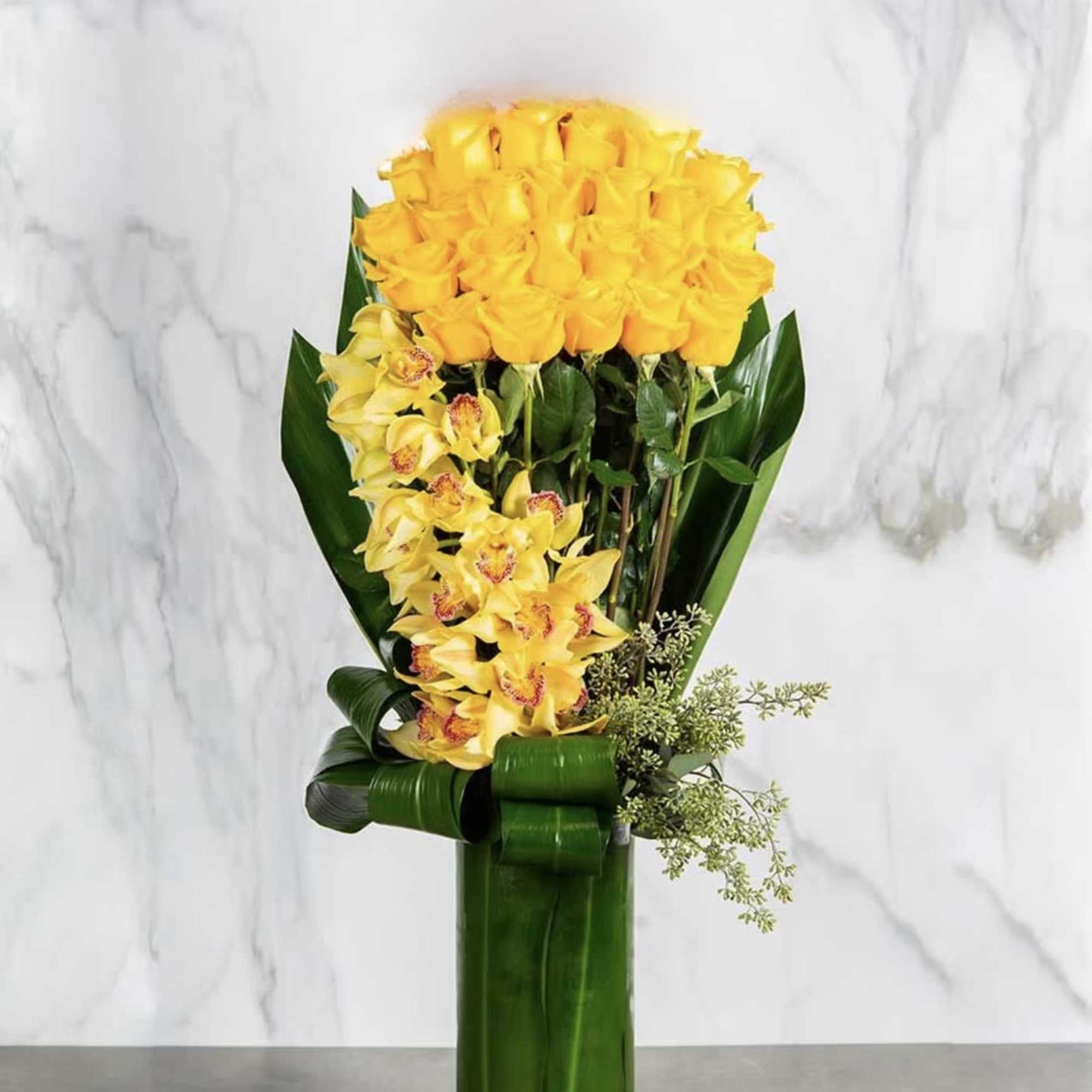 Gallant &amp; Gold is a stunning arrangement of Roses, Cymbidium Orchids, Dried