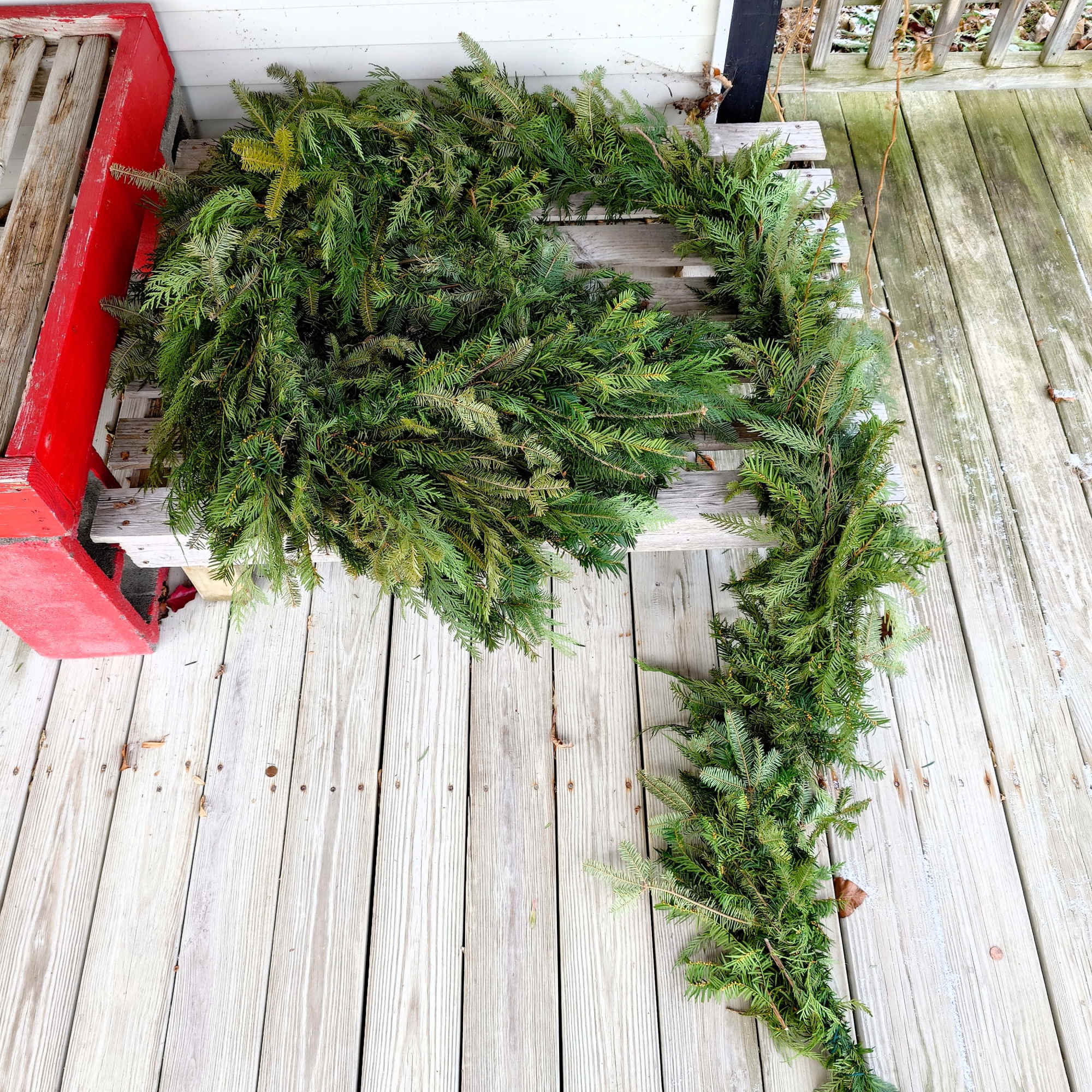 Our handcrafted evergreen garland is made fresh to order using a seasonal