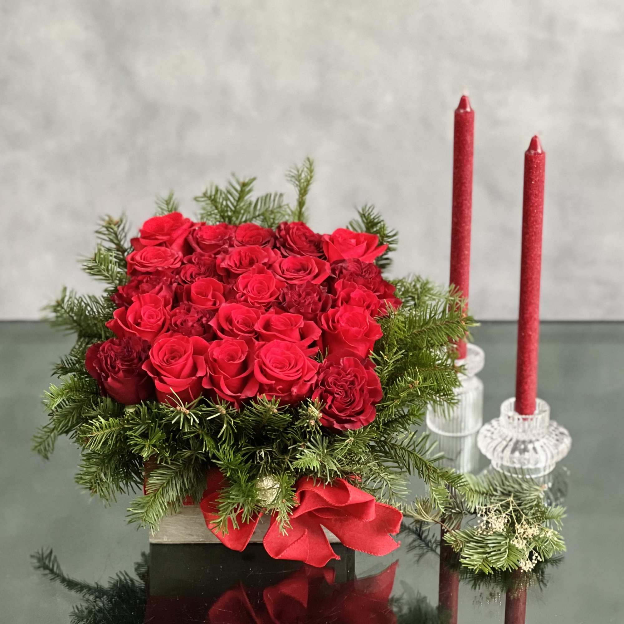 Send season&rsquo;s greetings in classic style. This charming Christmas centerpiece is hand-arranged
