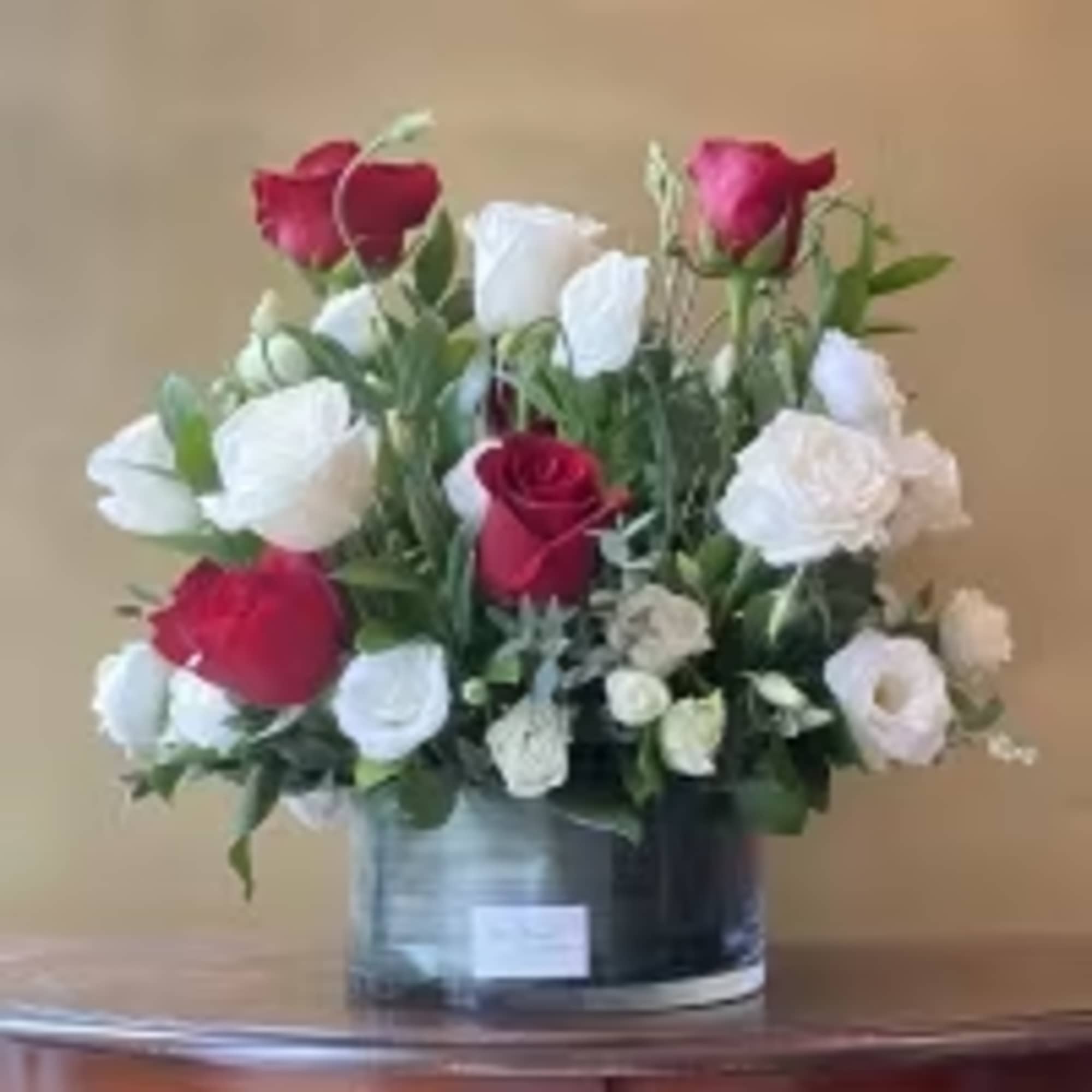 Serenade your love with this beautiful bouquet of red and white roses!