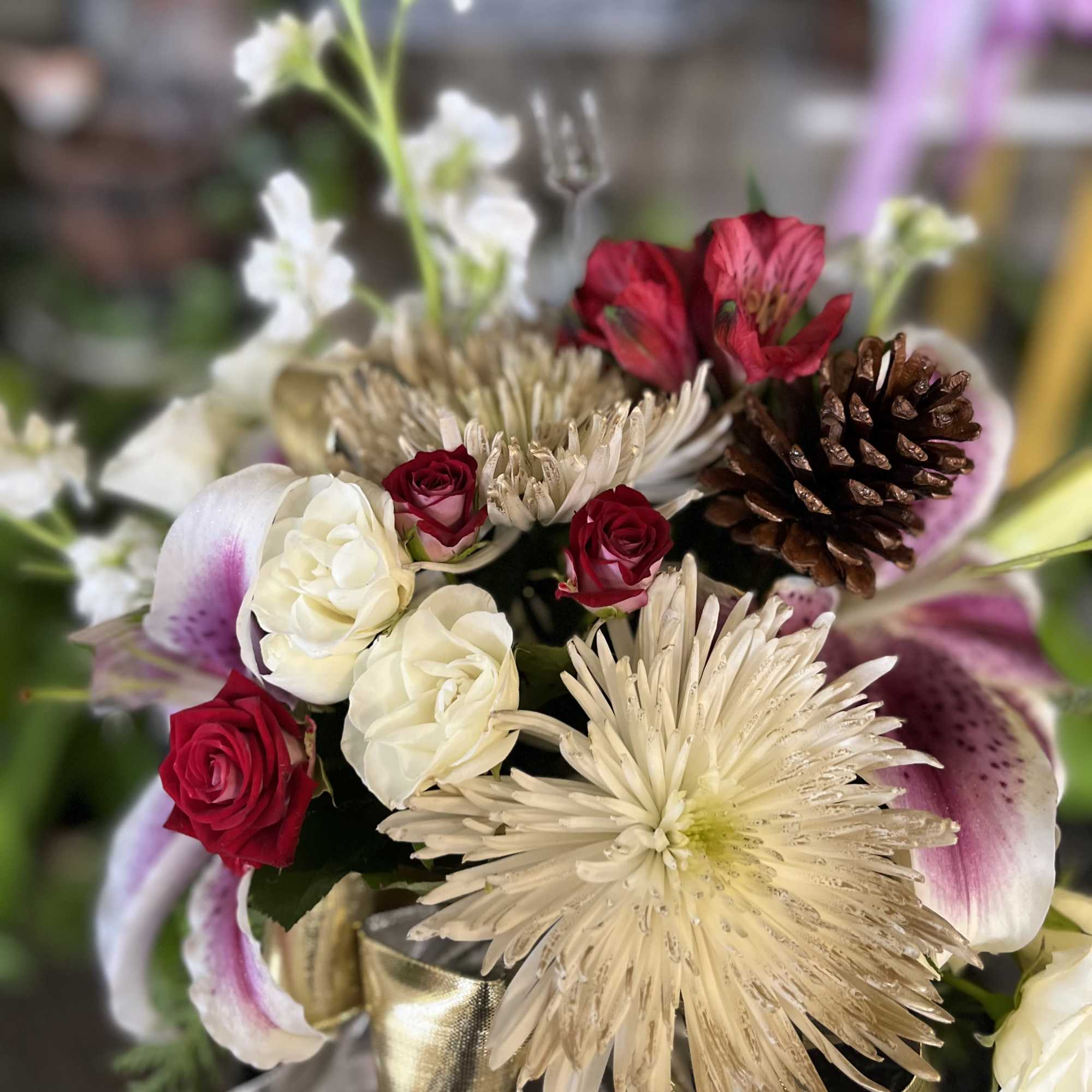 fresh flowers in gold cube 
