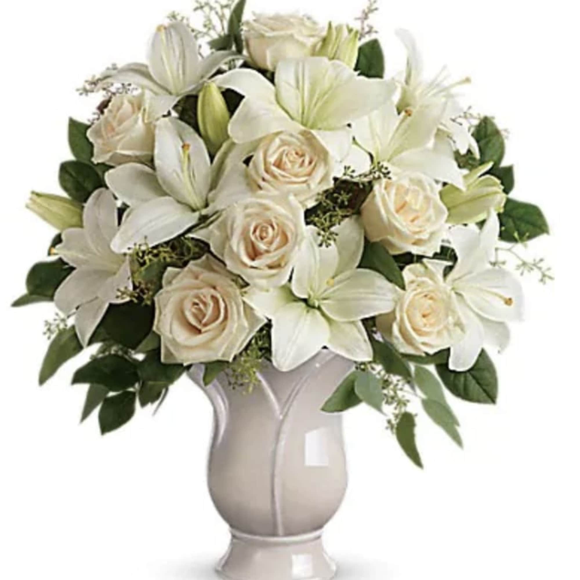 Celebrate a wondrous life with this timeless tribute of pure white lilies