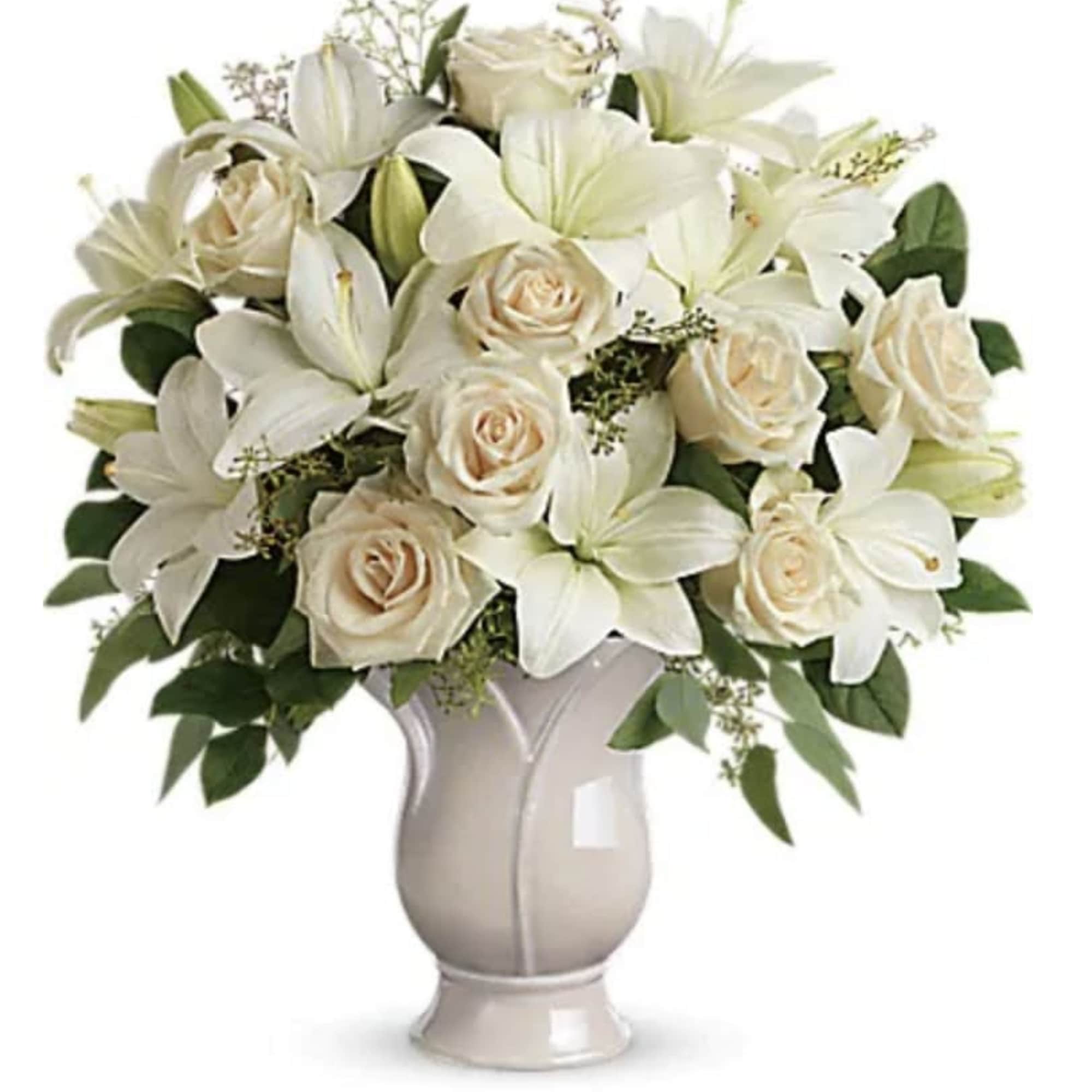 Celebrate a wondrous life with this timeless tribute of pure white lilies
