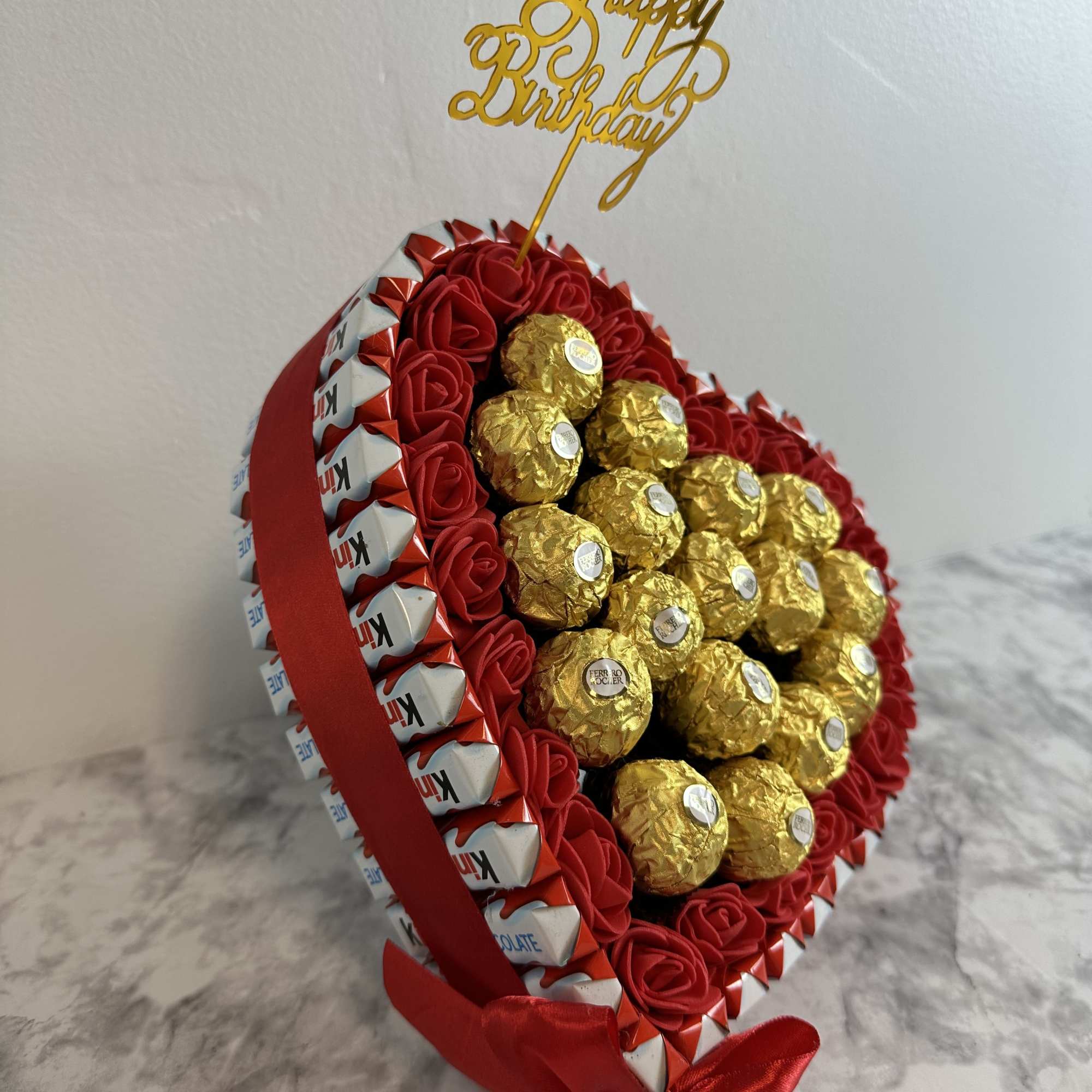 Heart-shaped box of chocolates with Ferrero Rocher and Kinder Bueno, decorated with