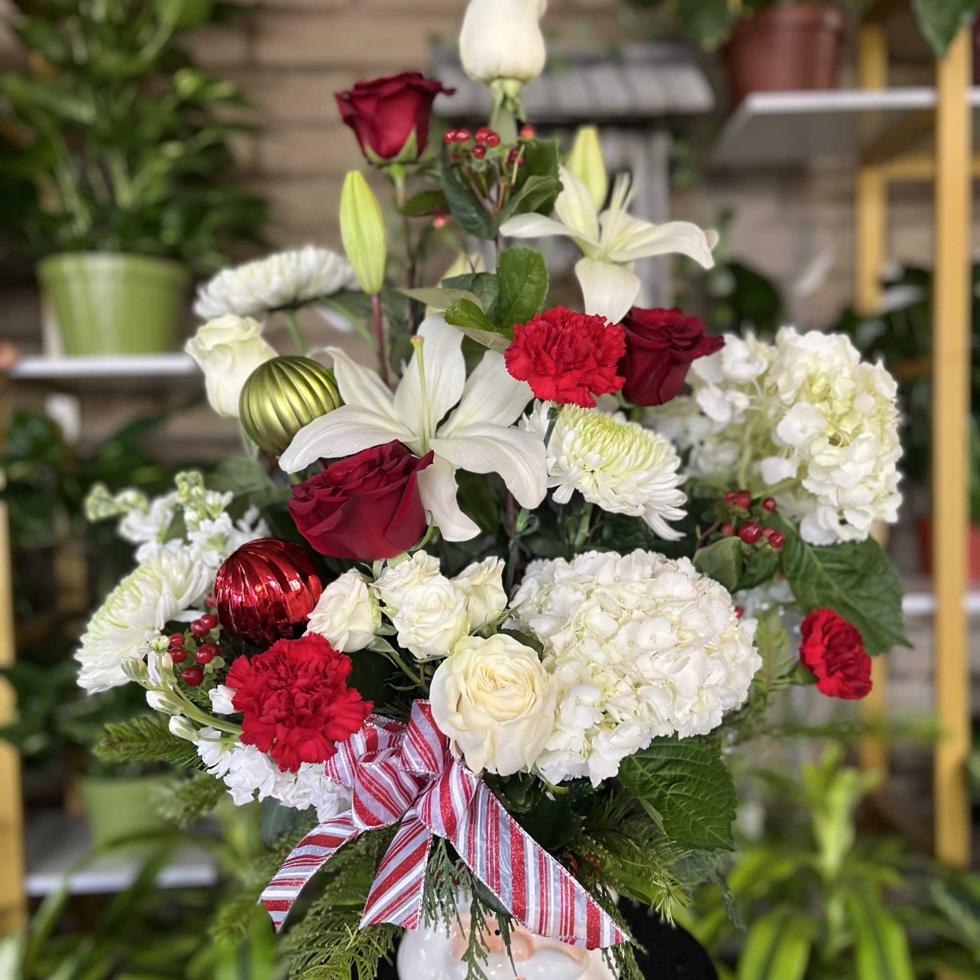 fresh flowers in Santa vase with pine 