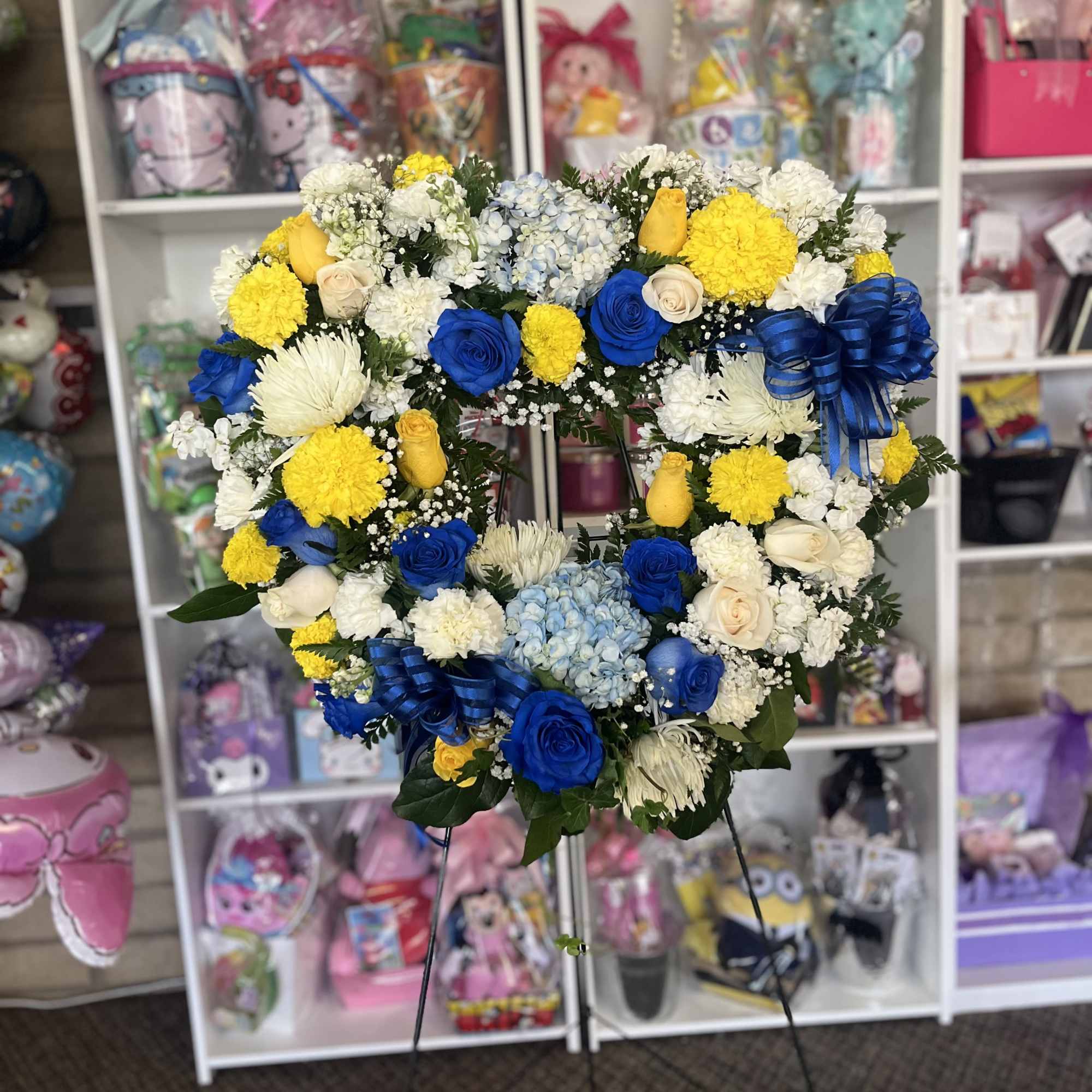 24 inch floral heart 
Add banner , insert message on banner on