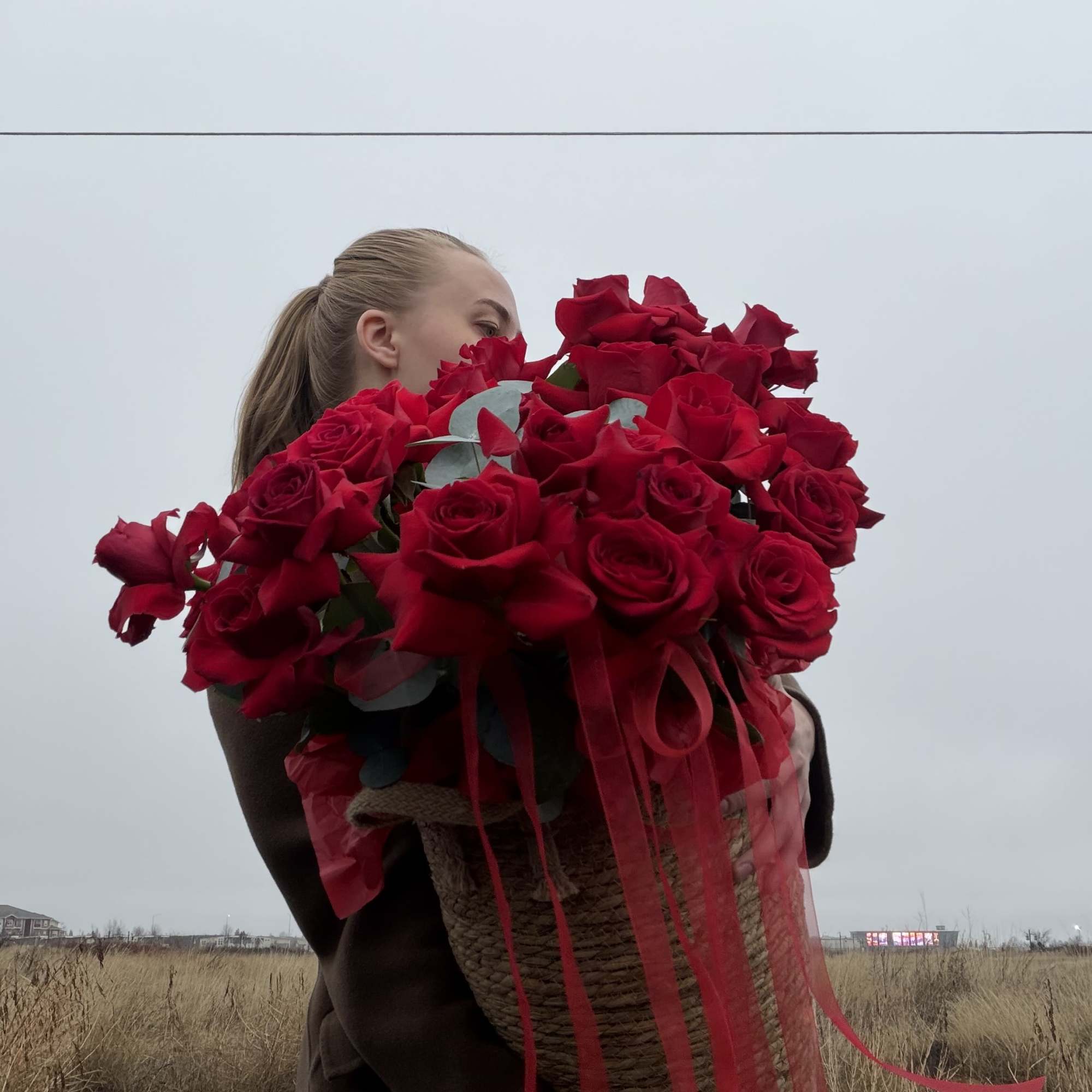 This stunning arrangement features a lush collection of premium red roses, expertly