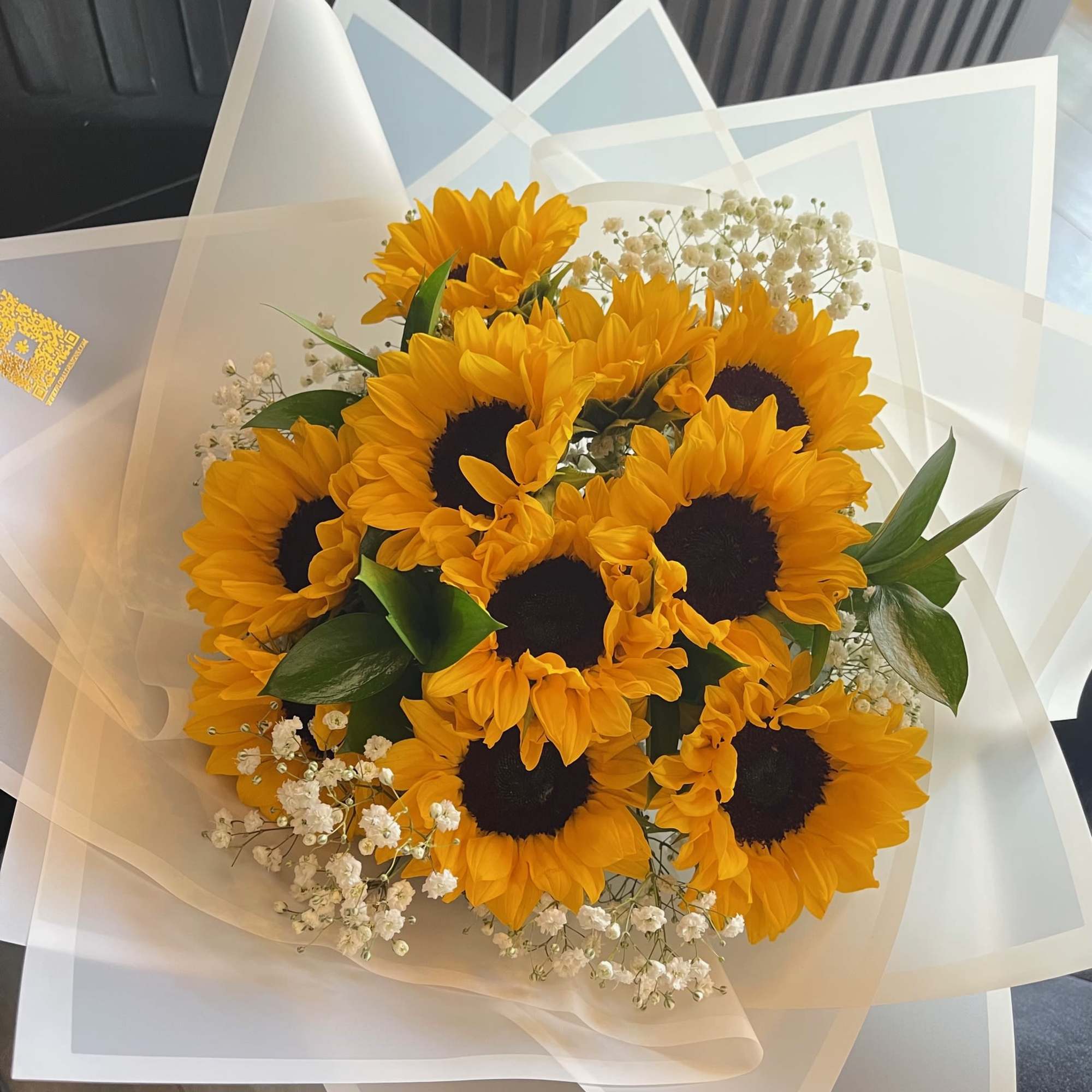 Radiating joy and positivity, the Sunshine Embrace Bouquet features a vibrant arrangement