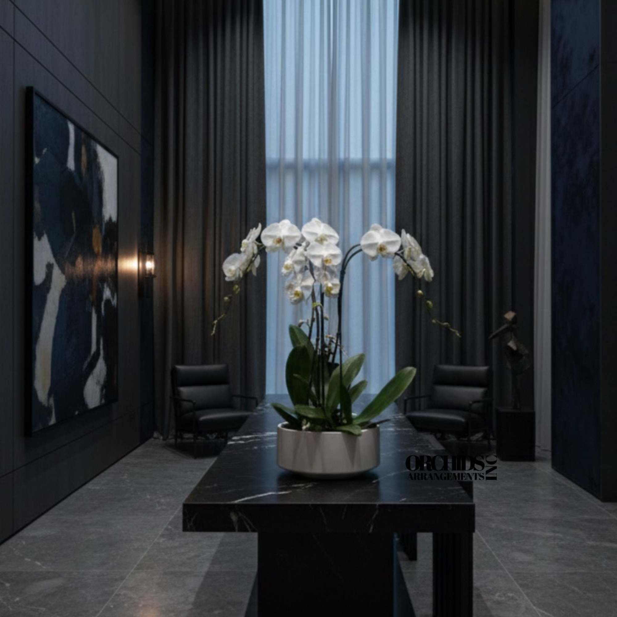 A high quality Triple white orchid arrangement with a vase 9" D