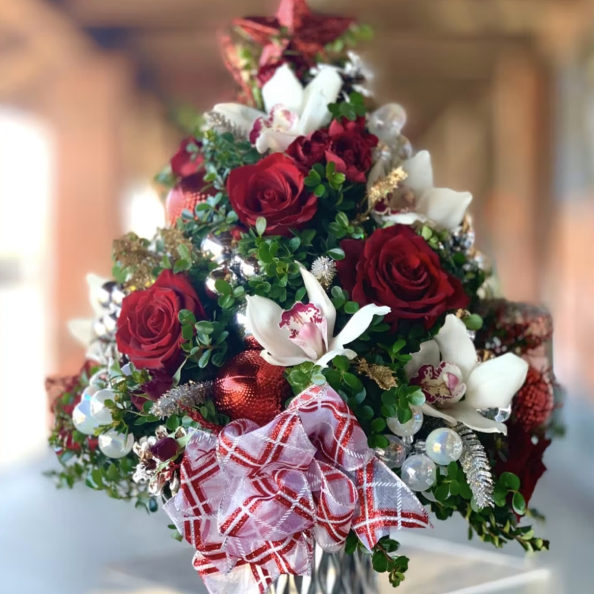 PREMIUM - A Christmas tree made with boxwood green and assorted flowers