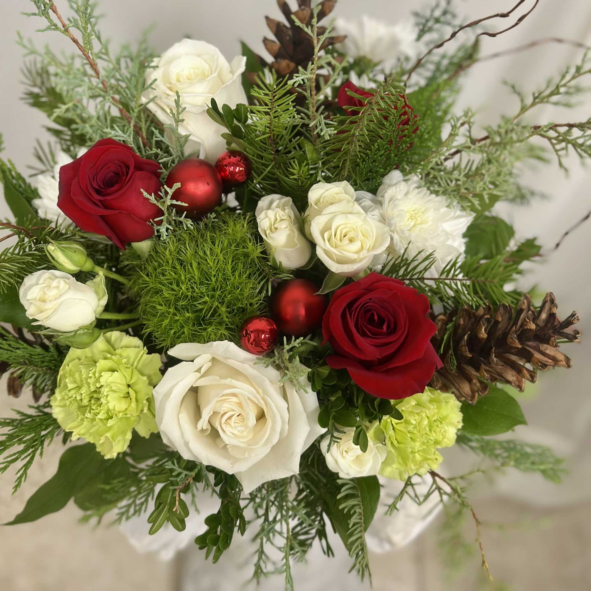Embrace the spirit of the season with "Cozy Christmas" by Westford Florist