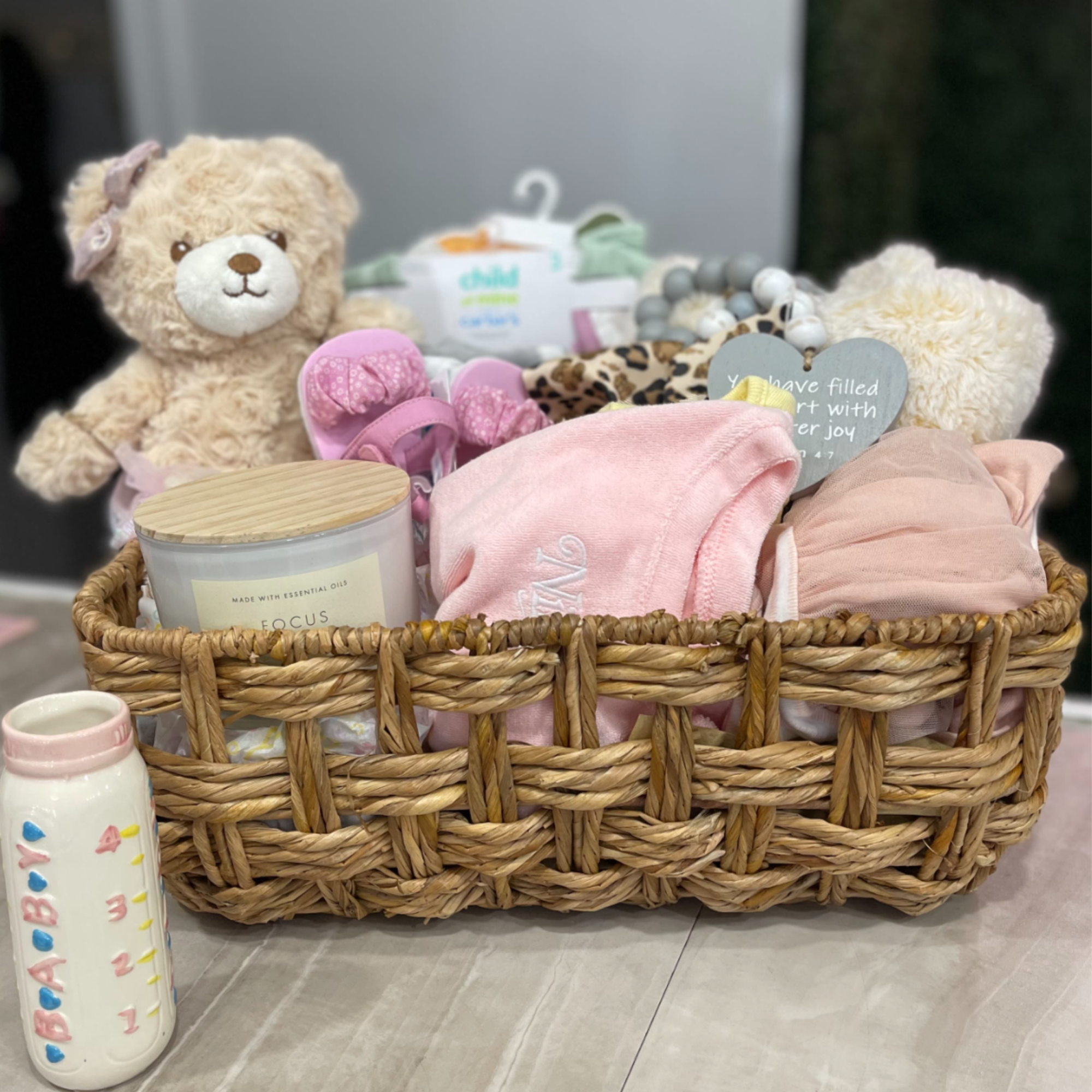 Welcome the newest little baby girl home with a gift basket bursting