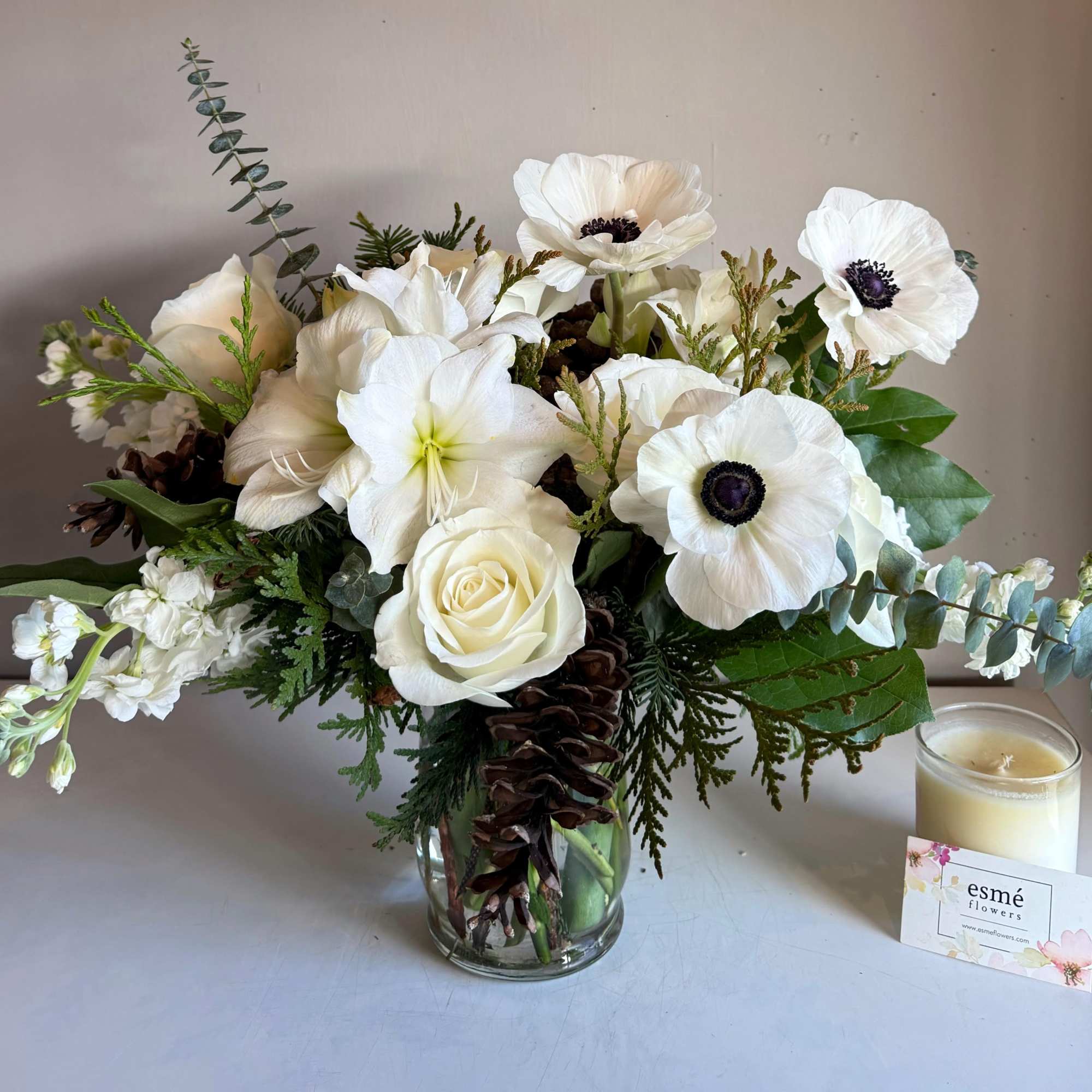 A gathering of pure whites, featuring Amaryllis and Italian Mistral Anemones. A