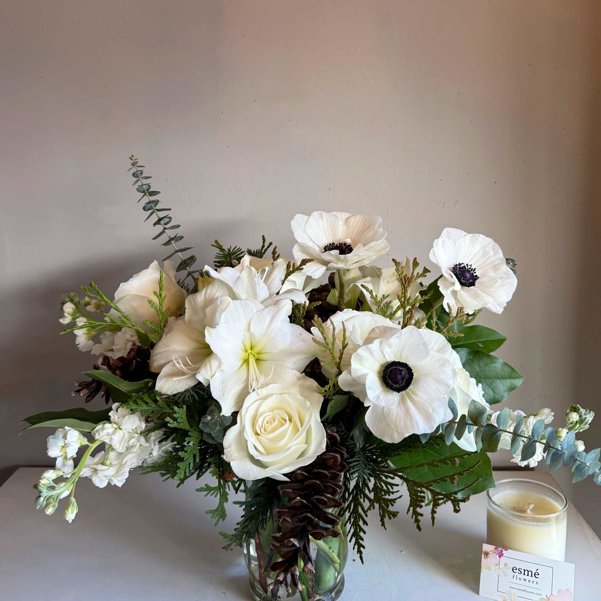 A gathering of pure whites, featuring Amaryllis and Italian Mistral Anemones. A