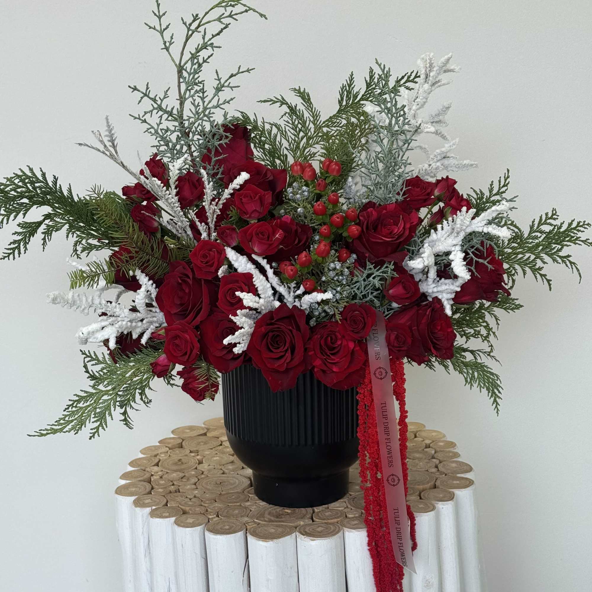 Celebrate the magic of the holidays with this luxurious Christmas flower arrangement
