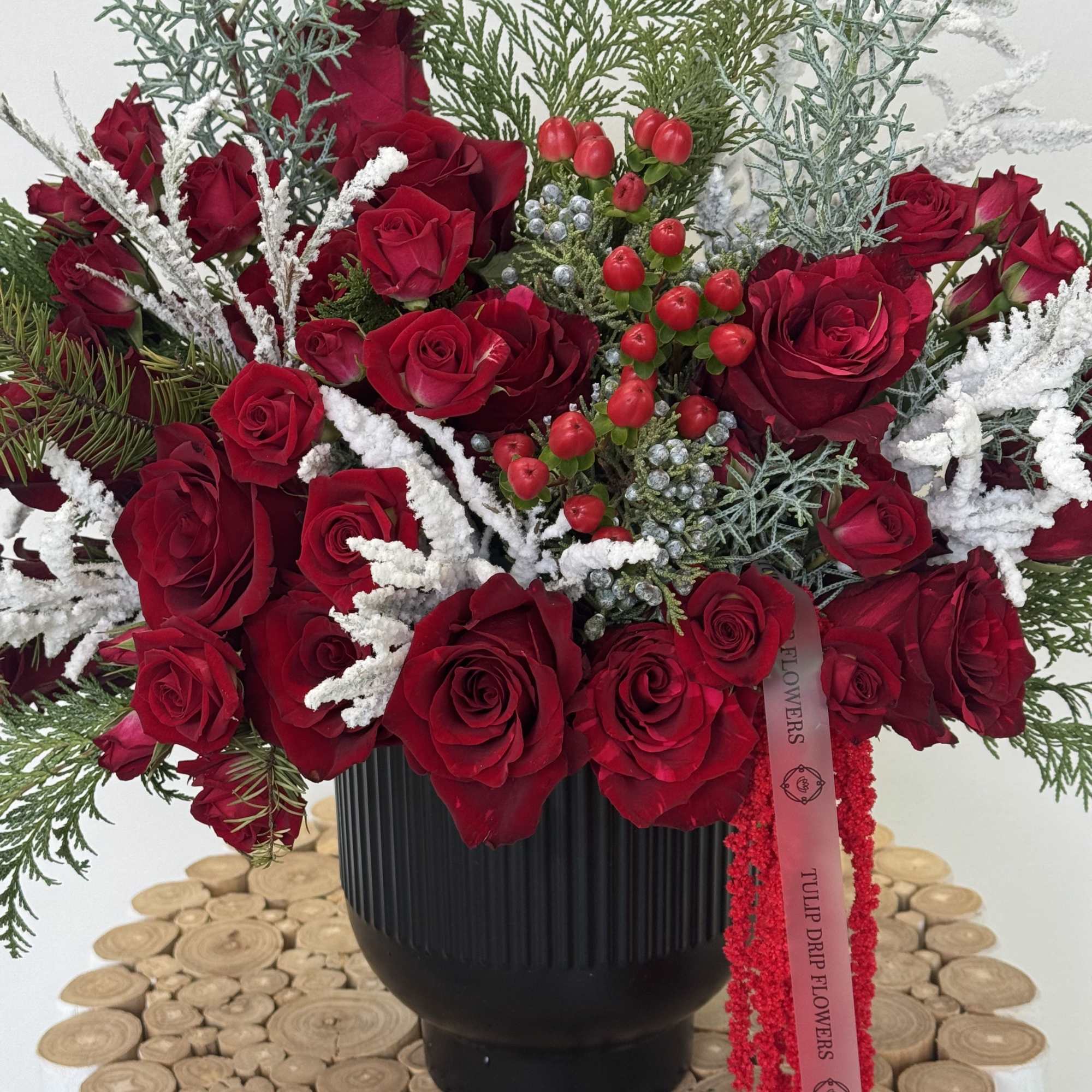Celebrate the magic of the holidays with this luxurious Christmas flower arrangement