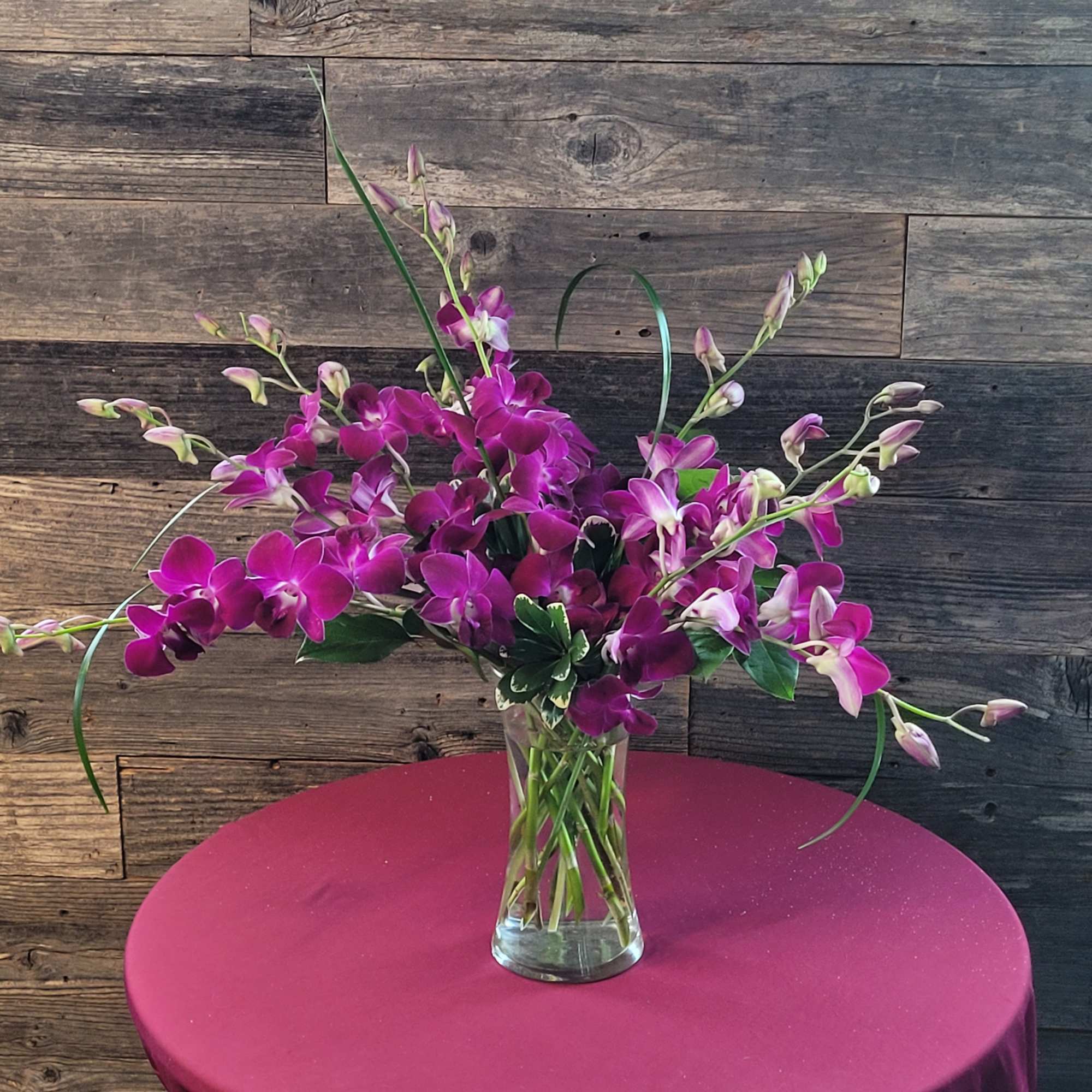 This array of orchids is sure to bring a smile to that