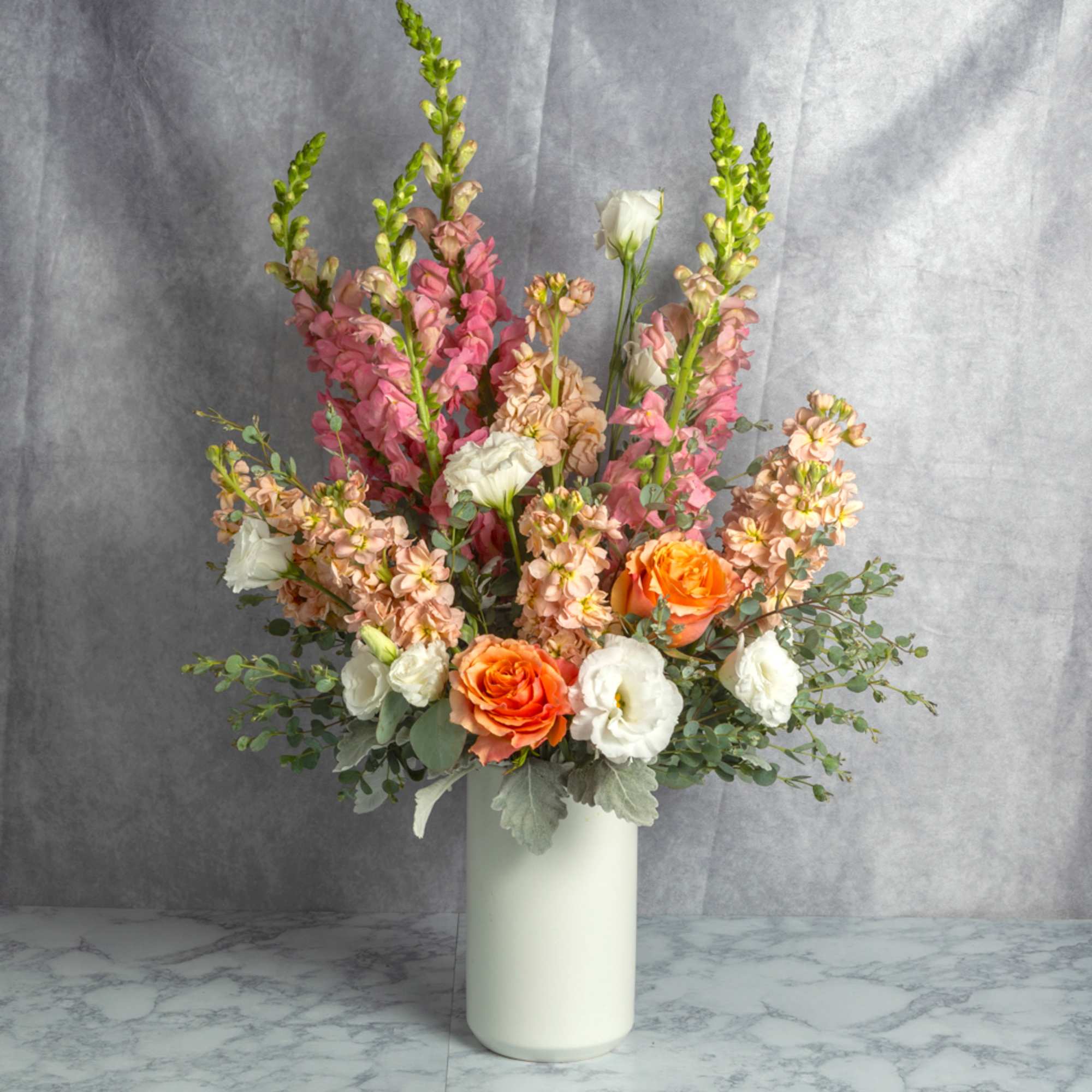A stunning display of peach, white, and orange blooms you can find