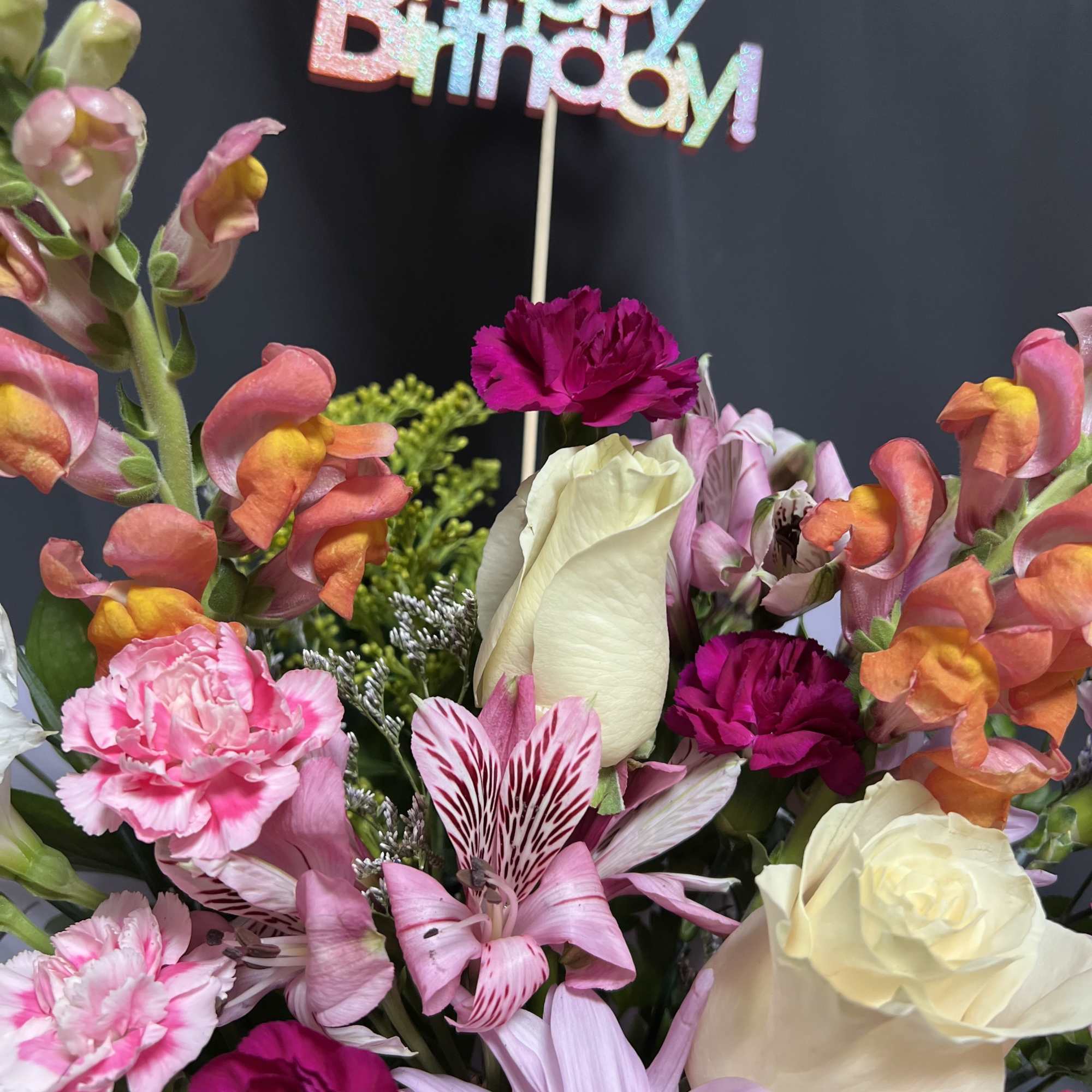 Celebrate in full colour with this joyful floral arrangement, designed to brighten