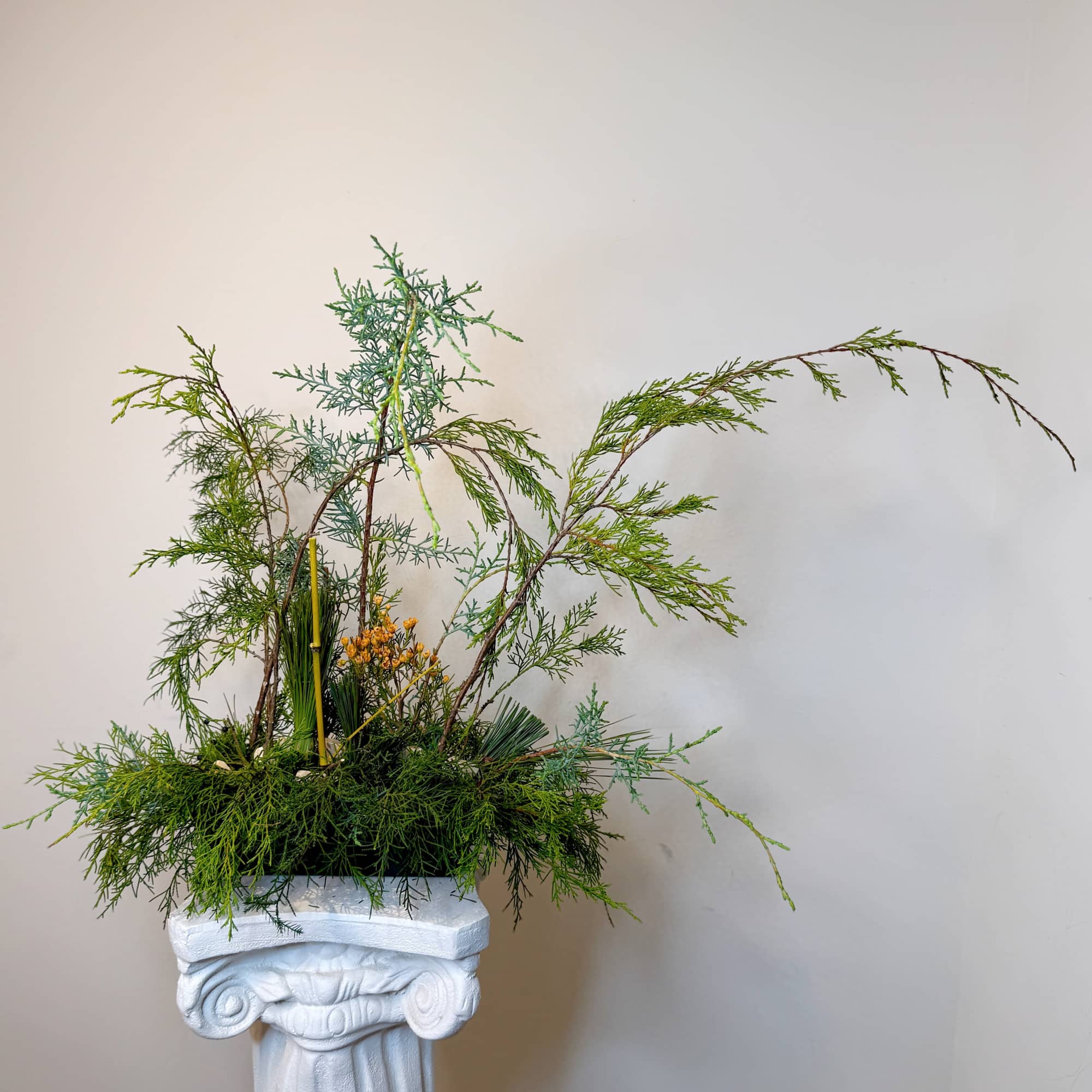 A sculptural botanical composition created from carefully selected foliage and natural lines