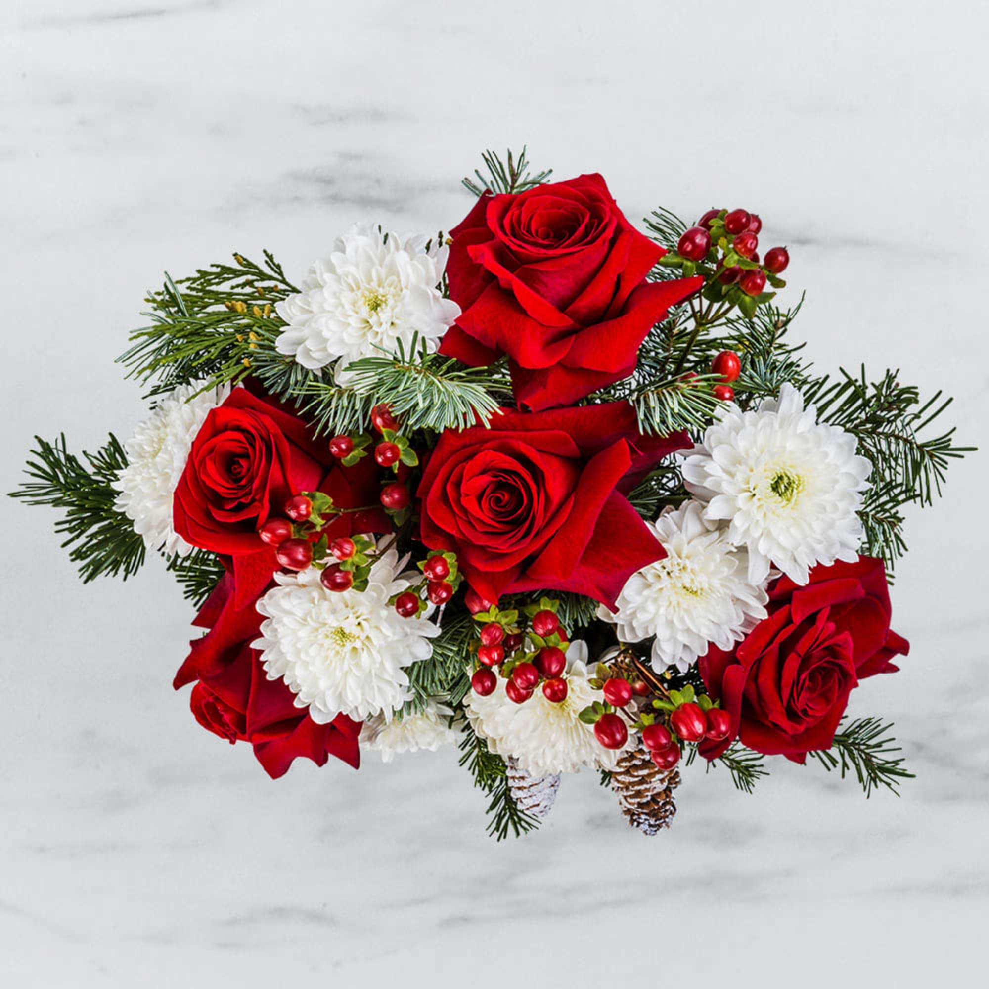 This festive display of frost and berries is sure to bring holiday