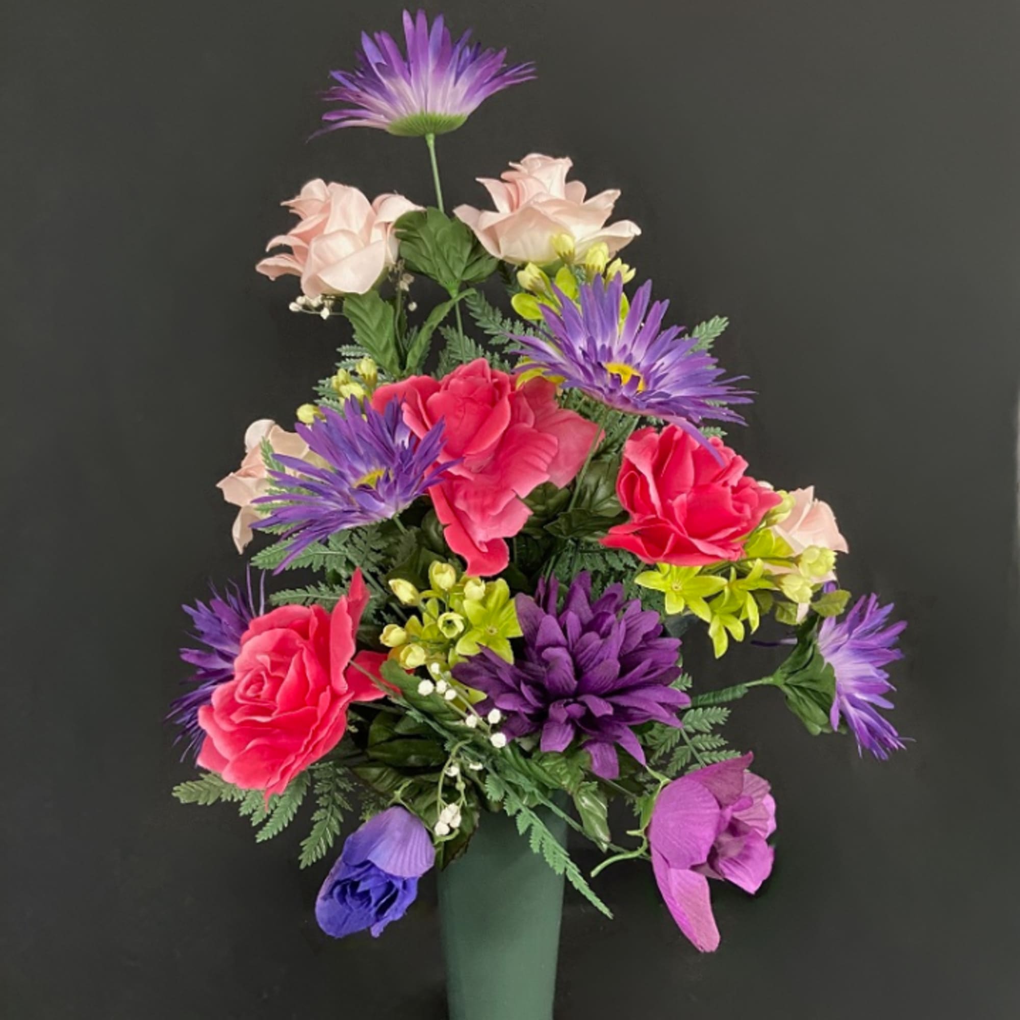An arrangement of weather resistant silk flowers perfect for display at a