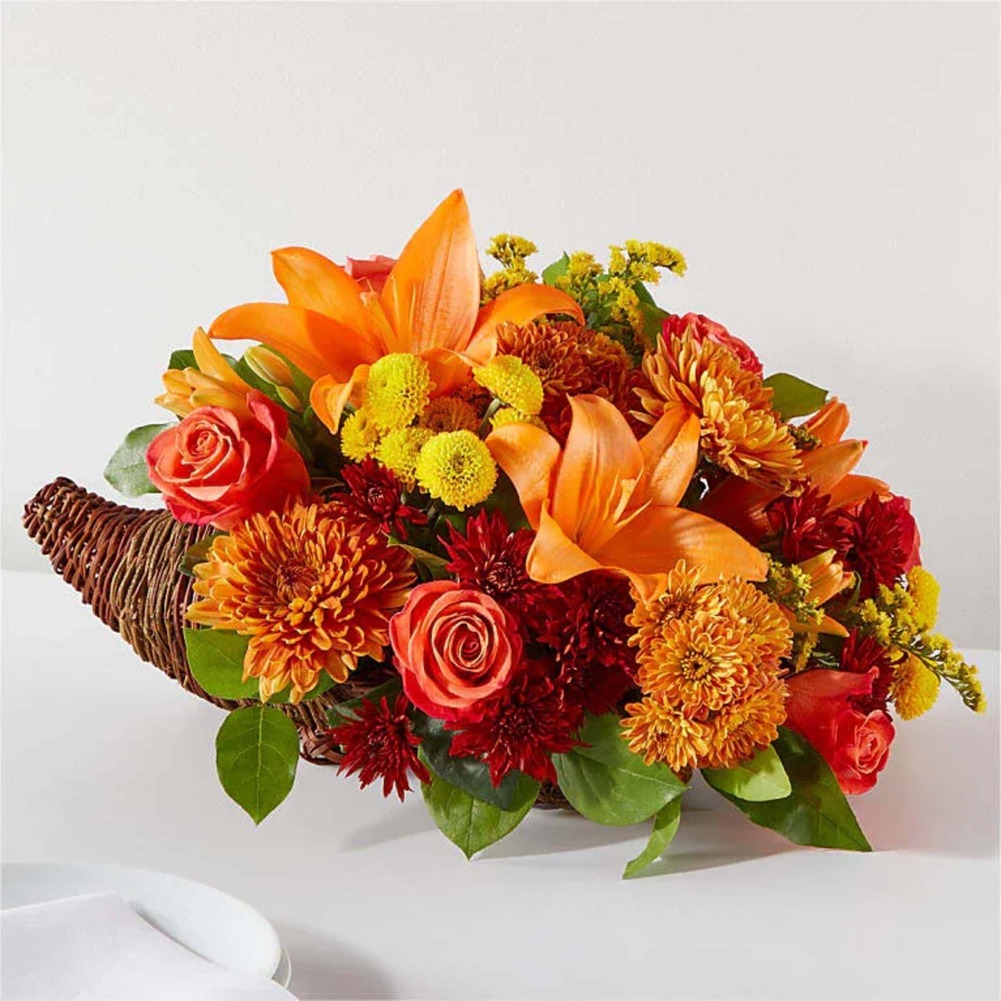 Embrace the spirit of Thanksgiving with a centerpiece that's bursting with bountiful