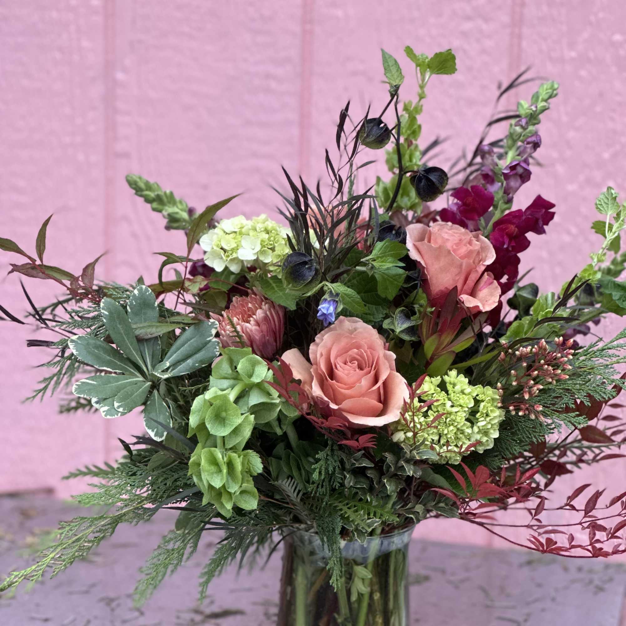 A Charming Bouquet Featuring the Freshest Blooms designed in a Mason Jar.