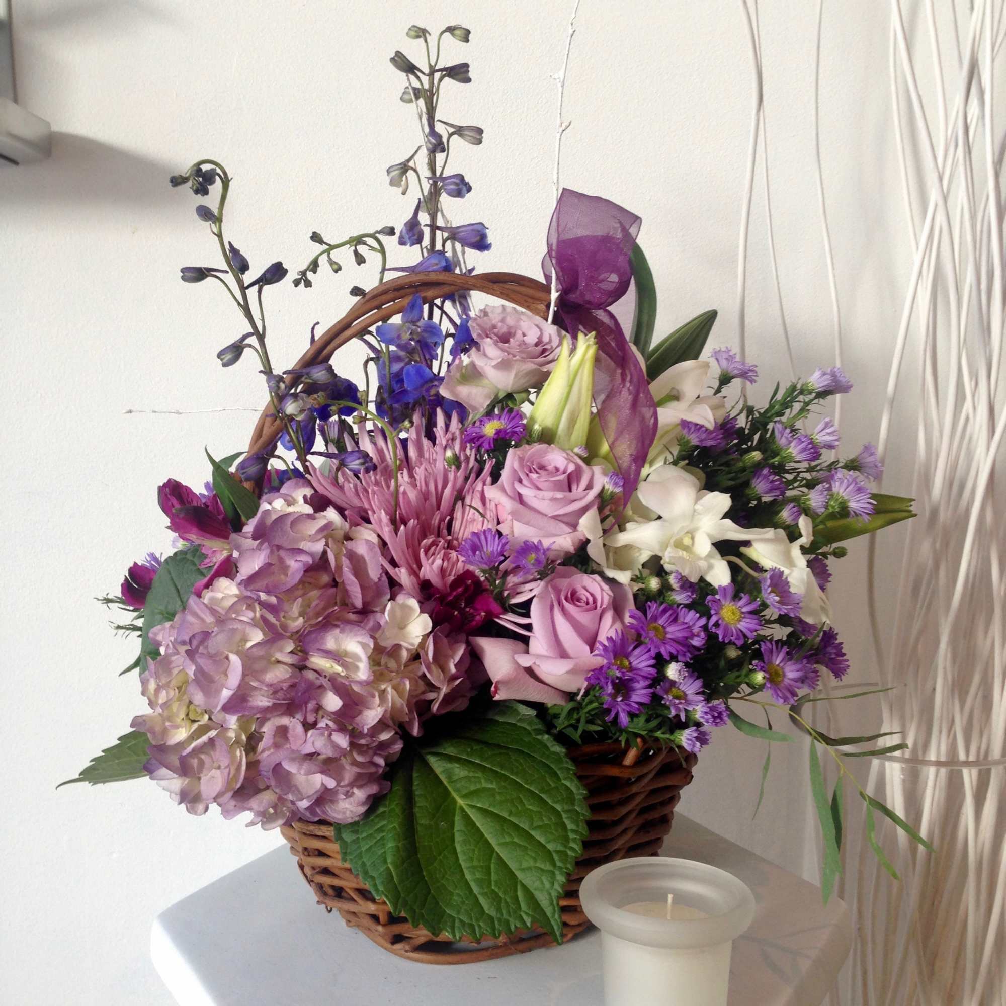 Lavender and lovely, our fresh-packed basket features roses, hydrangeas, daisies, alstroemeria, mums