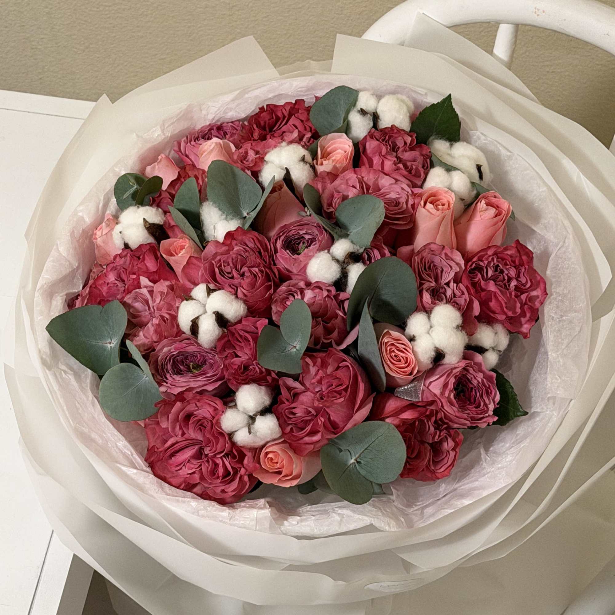 This exquisite bouquet is a true statement of elegance and romance. Featuring
