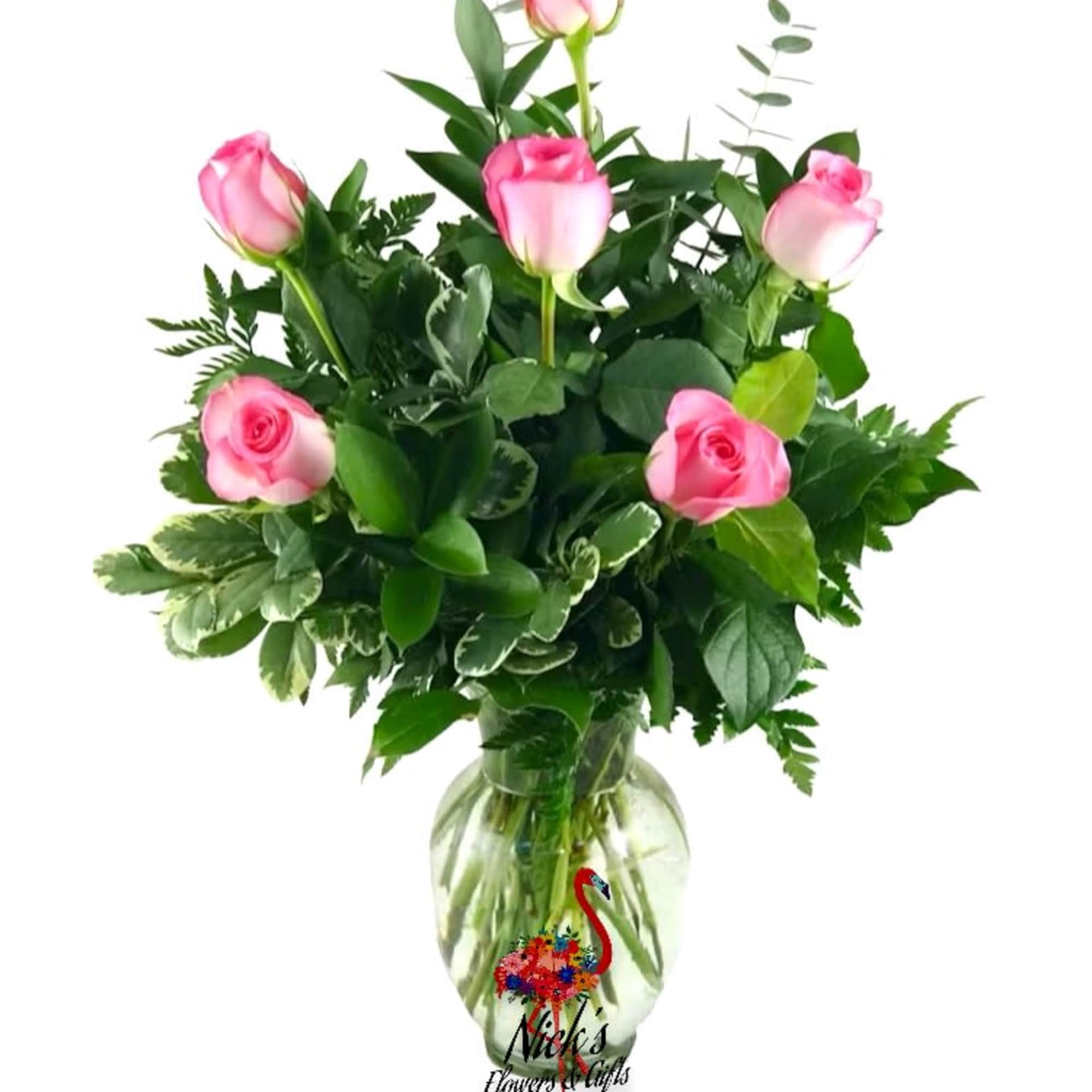 Half Dozen Pink Roses Hand Arranged With Lush Greens in a traditional