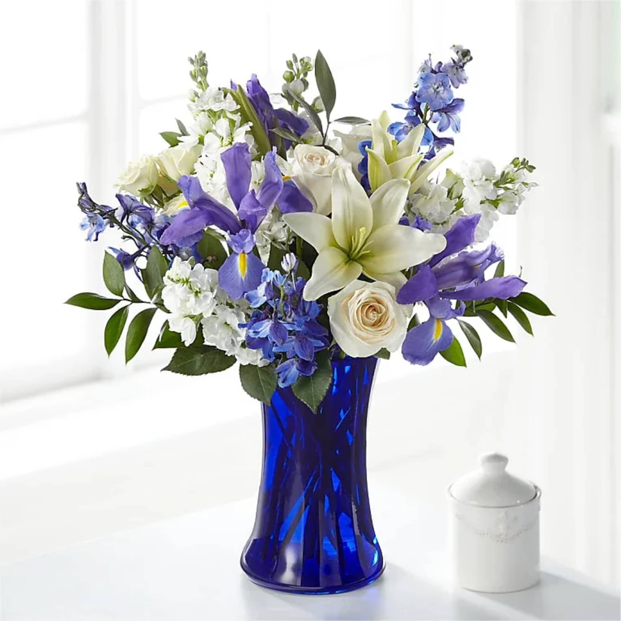 CALMING COMFORT BOUQUET

Accented by a deep blue vase, our Calming Comfort Bouquet