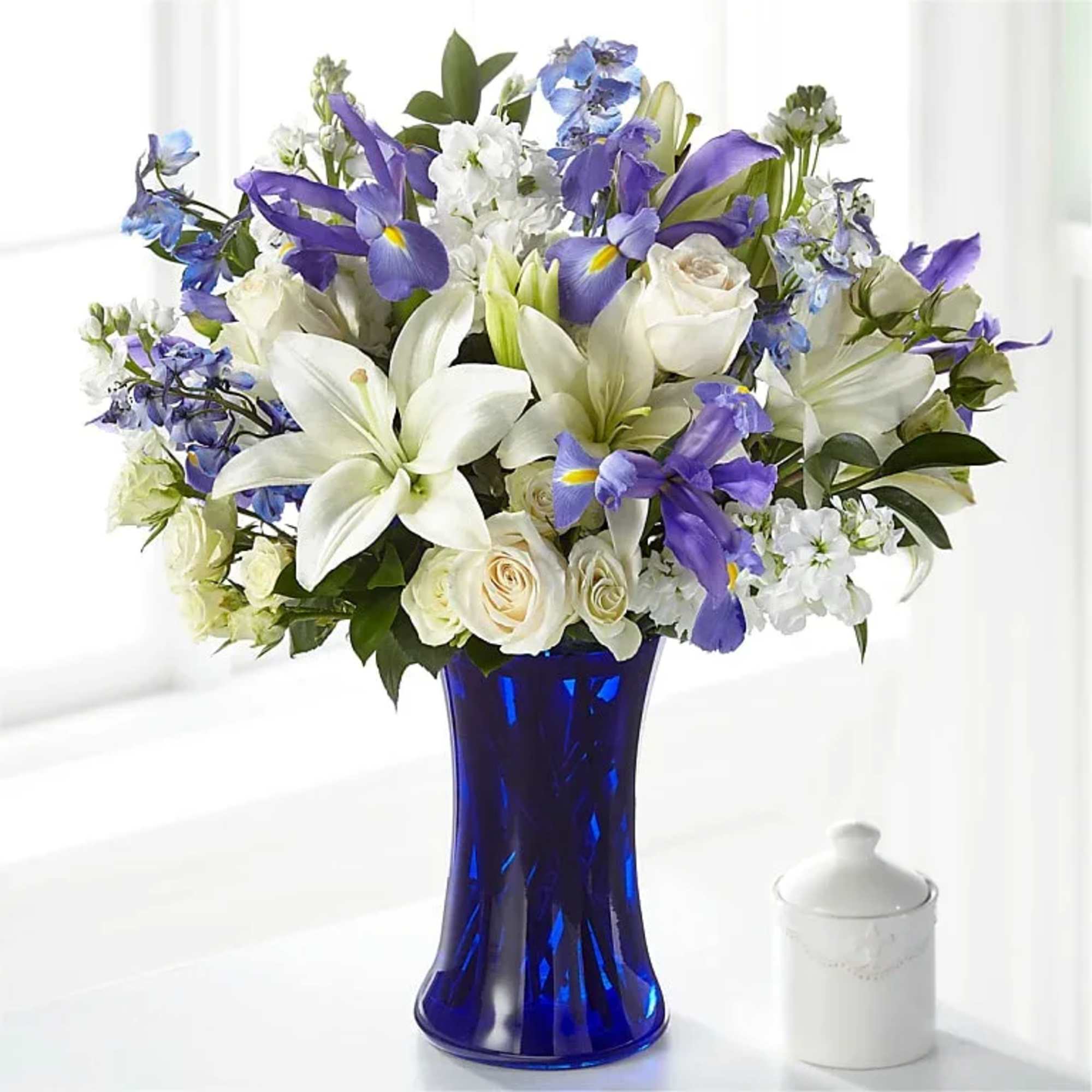 CALMING COMFORT BOUQUET

Accented by a deep blue vase, our Calming Comfort Bouquet