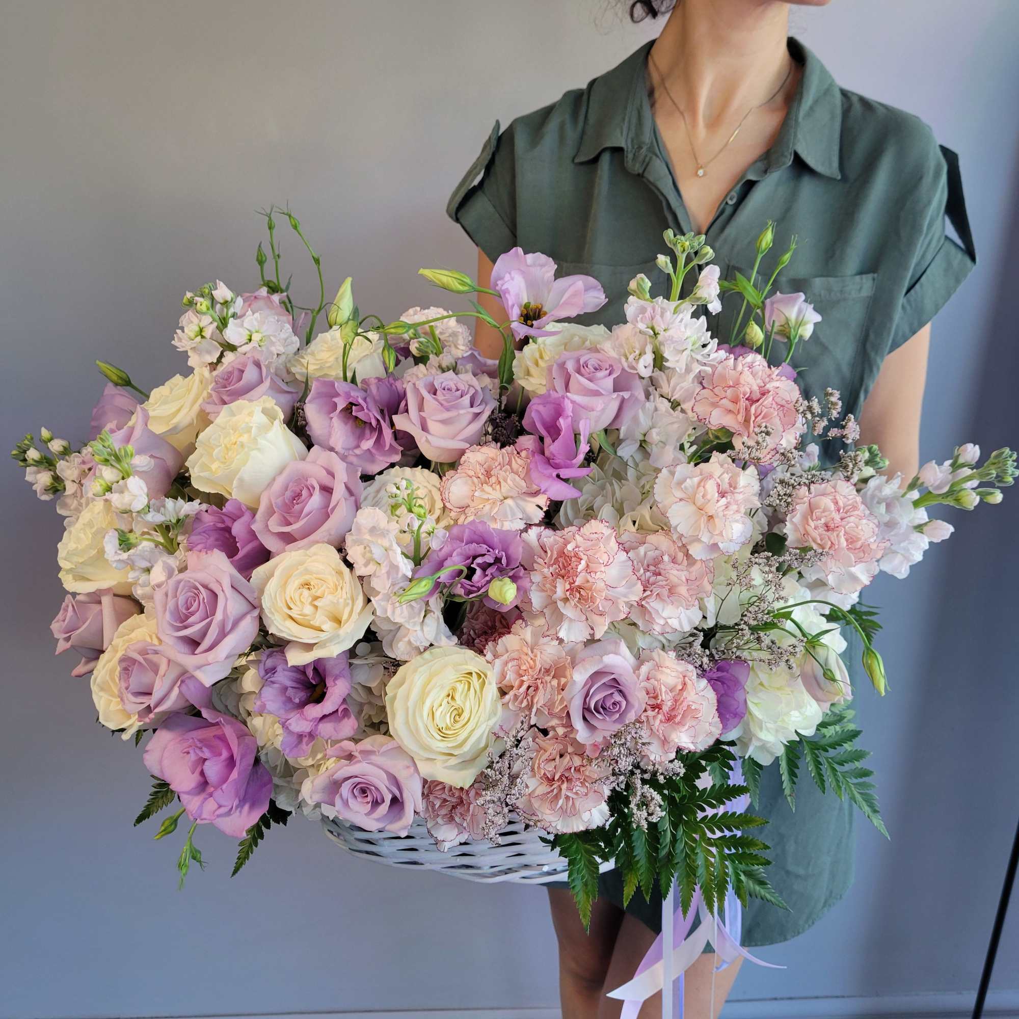 Elevate any occasion with our exquisite basket arrangement, showcasing a delightful mix