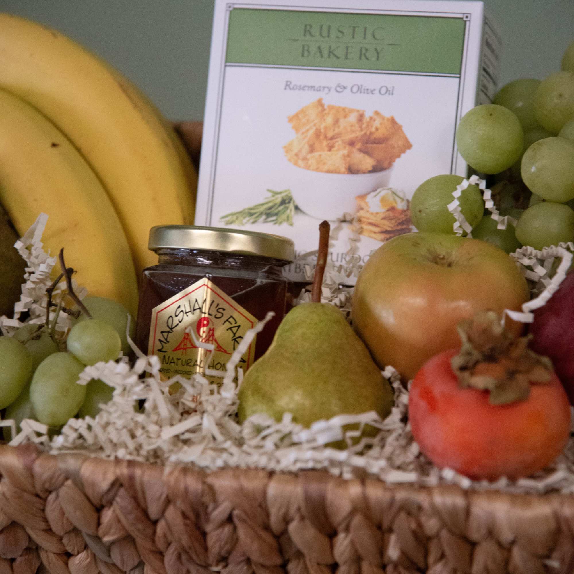 Our fruit basket is elevated with Rustic Bakery Crackers, local Napa honey