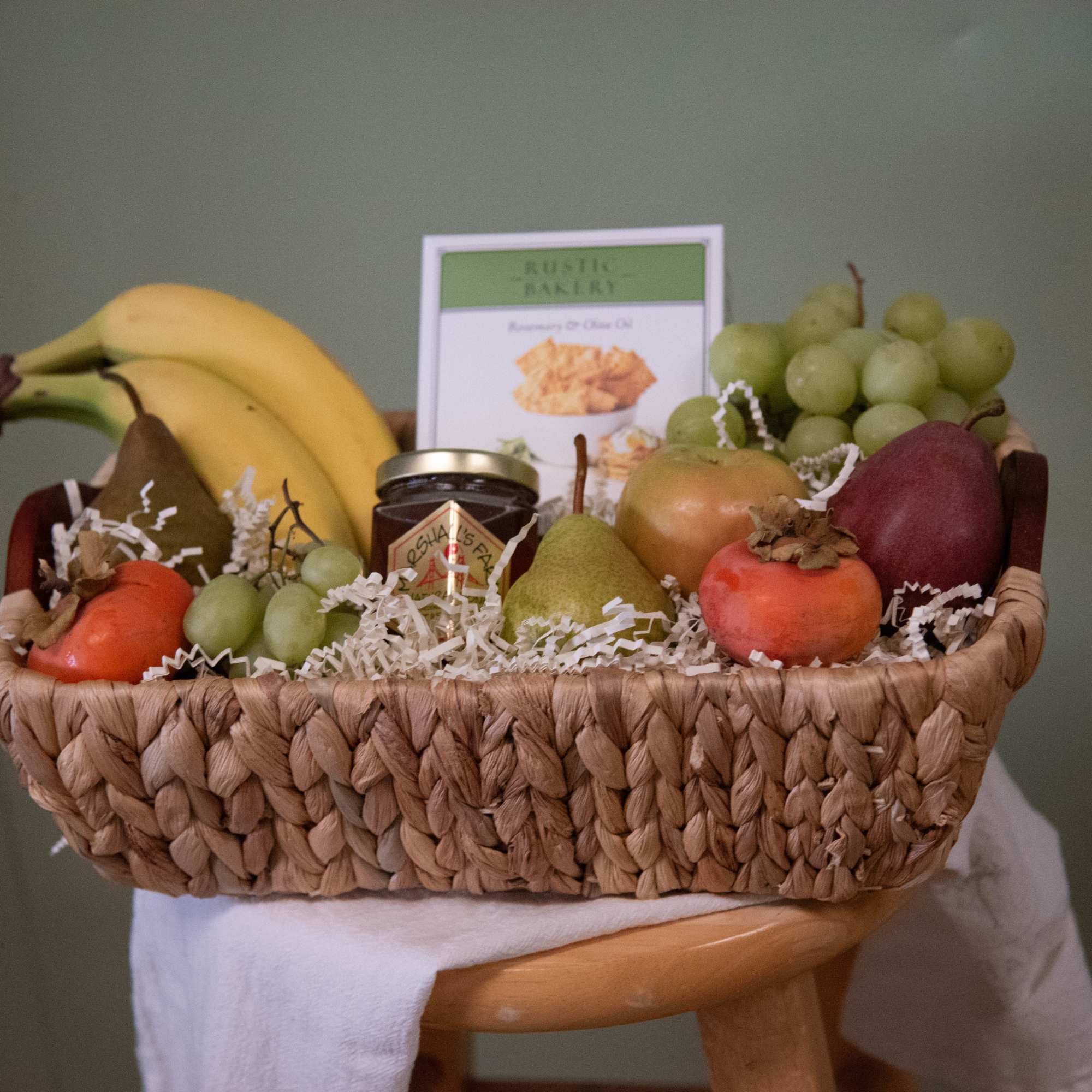 Our fruit basket is elevated with Rustic Bakery Crackers, local Napa honey