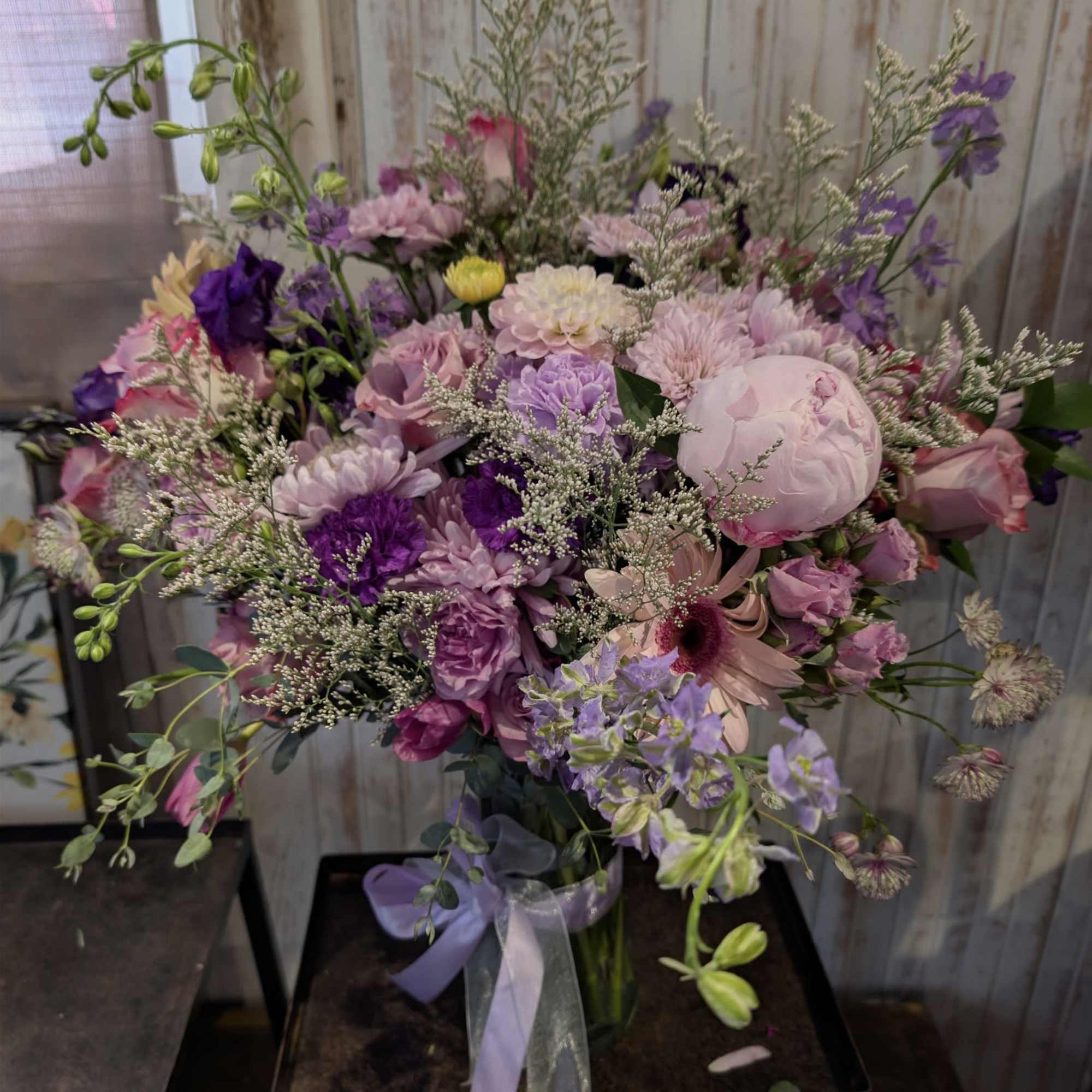Select our Designer's Choice - Lavender Blooms Bouquet arrangement to brighten your
